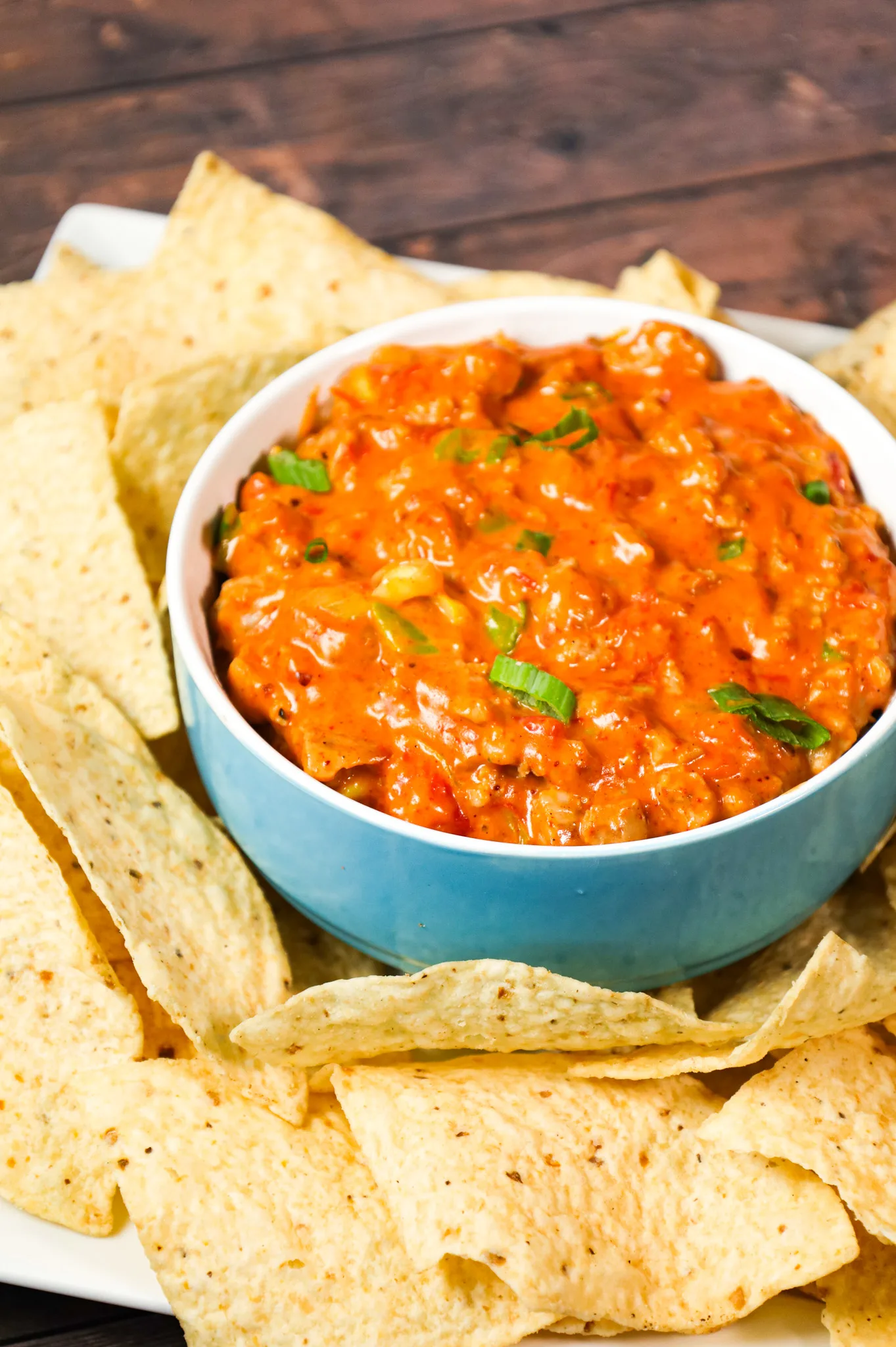 Rotel Dip is a cheesy dip made with Velveeta and loaded with ground sausage, Rotel diced tomatoes and green chilies, taco seasoning and chopped green onions.