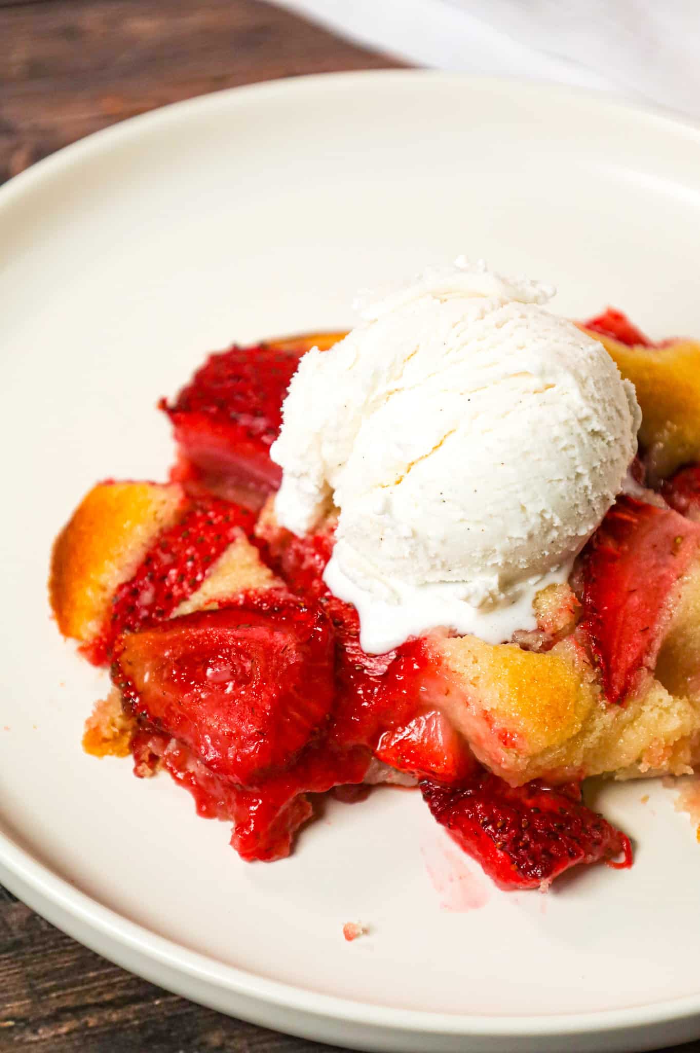 Strawberry Cobbler is an easy and delicious dessert recipe made with fresh strawberries baked in a delicious vanilla cake like batter.