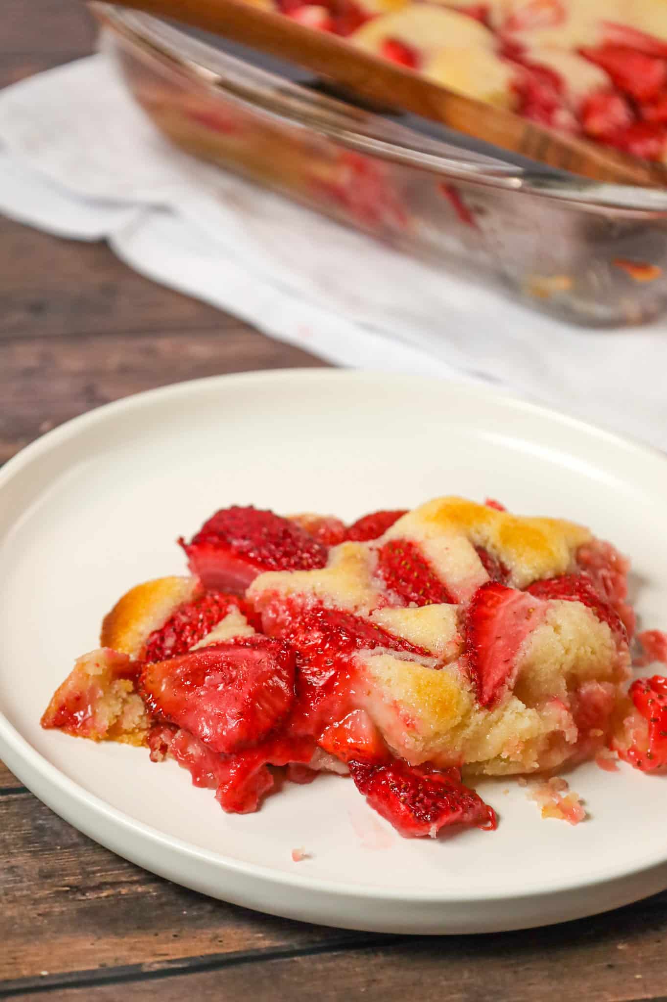 Strawberry Cobbler is an easy and delicious dessert recipe made with fresh strawberries baked in a delicious vanilla cake like batter.