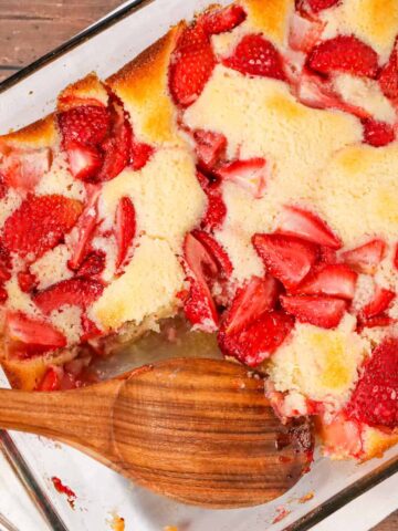 Strawberry Cobbler is an easy and delicious dessert recipe made with fresh strawberries baked in a delicious vanilla cake like batter.