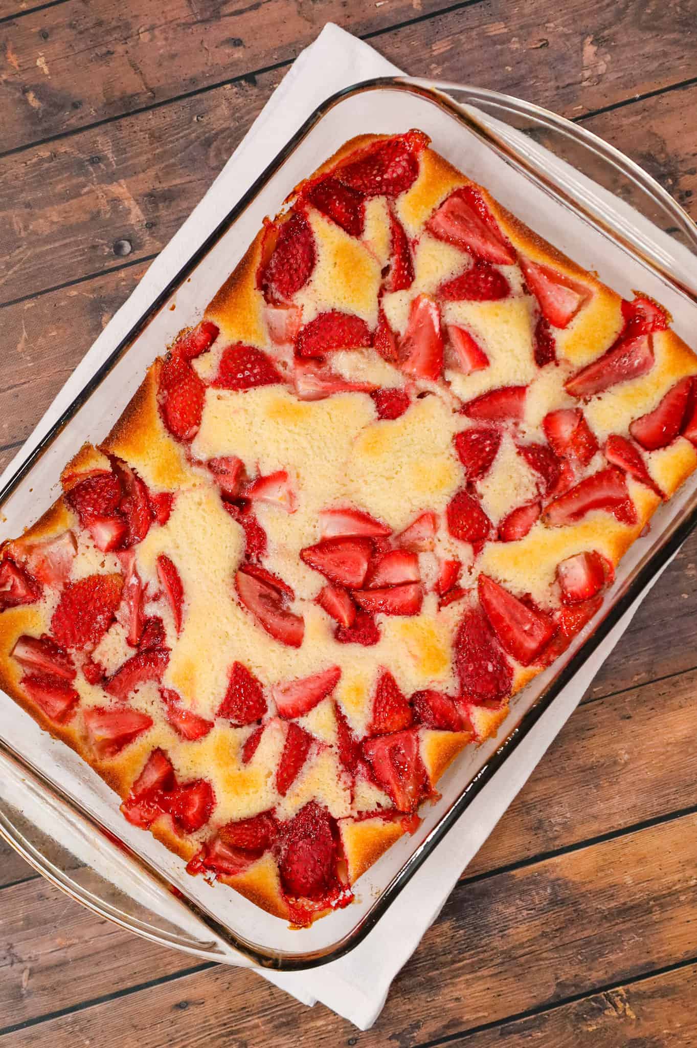 Strawberry Cobbler is an easy and delicious dessert recipe made with fresh strawberries baked in a delicious vanilla cake like batter.