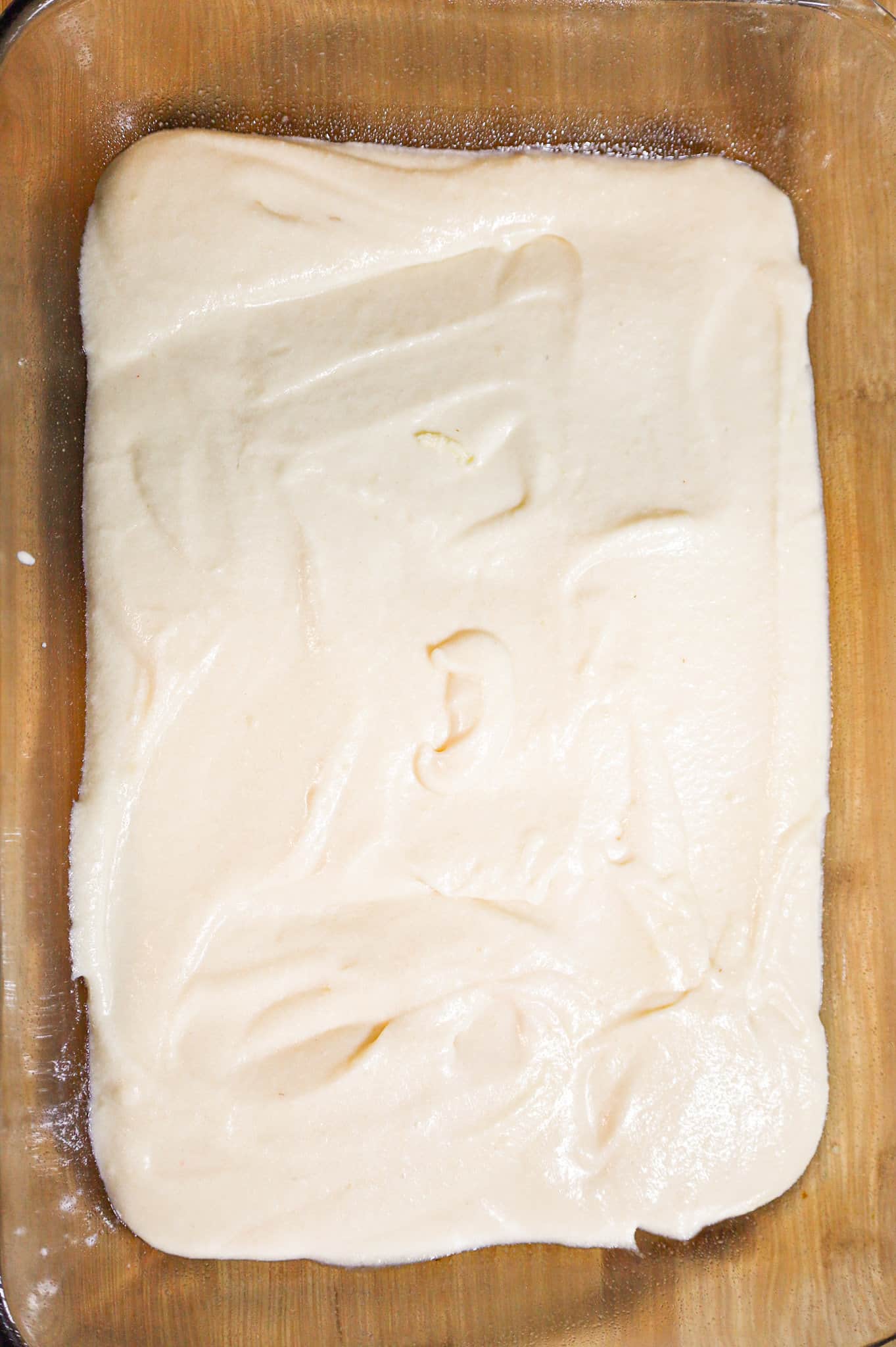 vanilla batter in a 9 x 13 inch baking dish