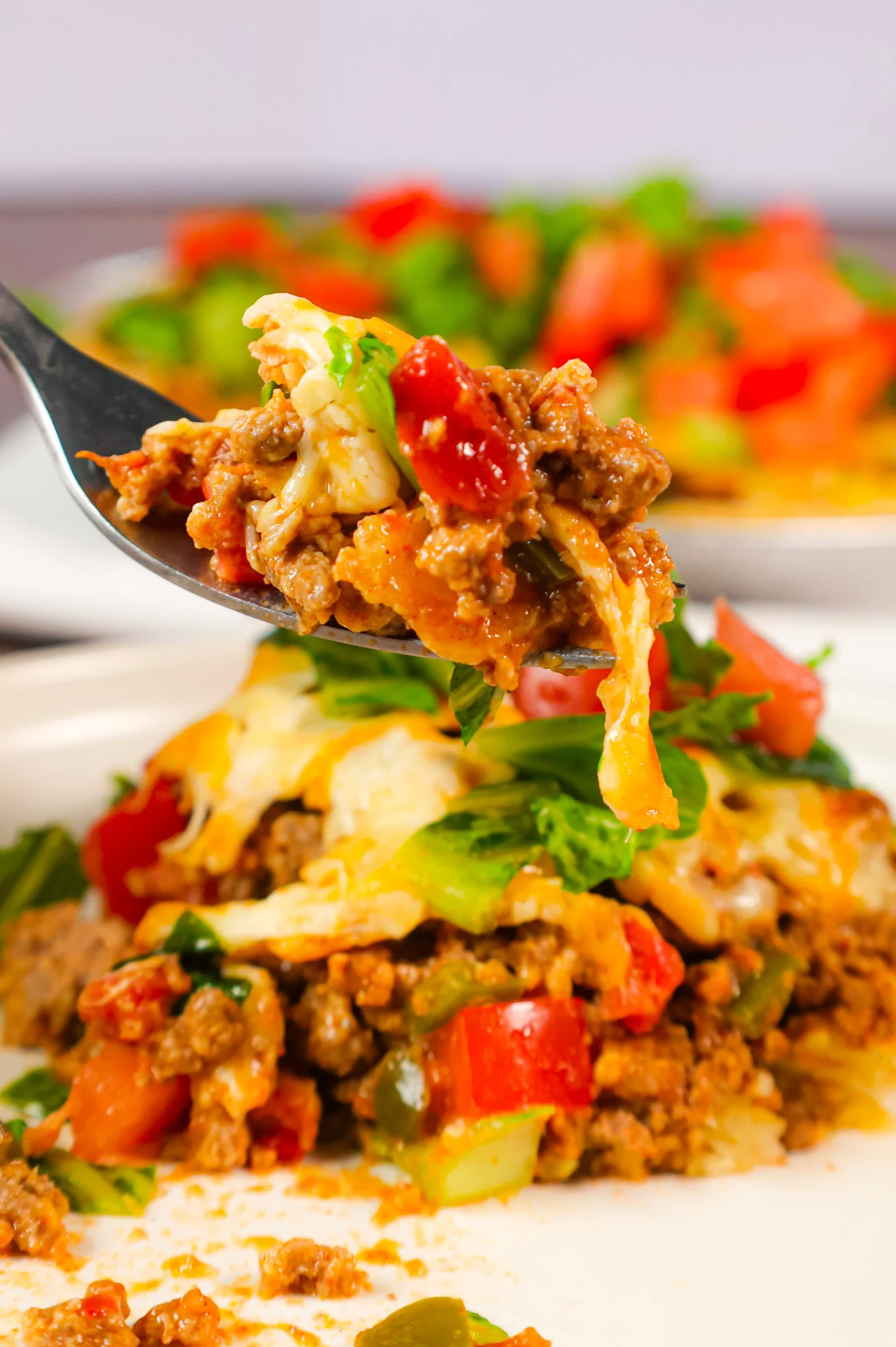 Taco Pie is an easy weeknight dinner recipe using a store bought pie crust loaded with ground beef, green peppers, Rotel and cheese.