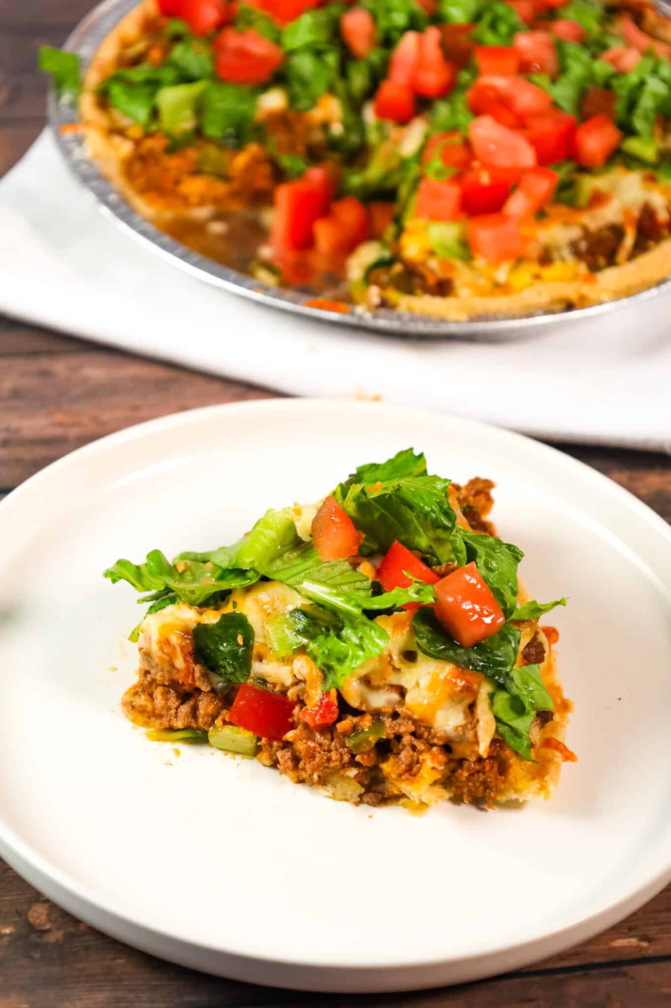 Taco Pie is an easy weeknight dinner recipe using a store bought pie crust loaded with ground beef, green peppers, Rotel and cheese.