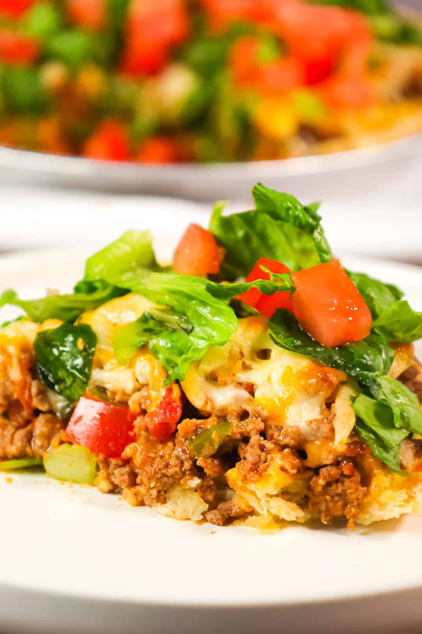 Taco Pie is an easy weeknight dinner recipe using a store bought pie crust loaded with ground beef, green peppers, Rotel and cheese.