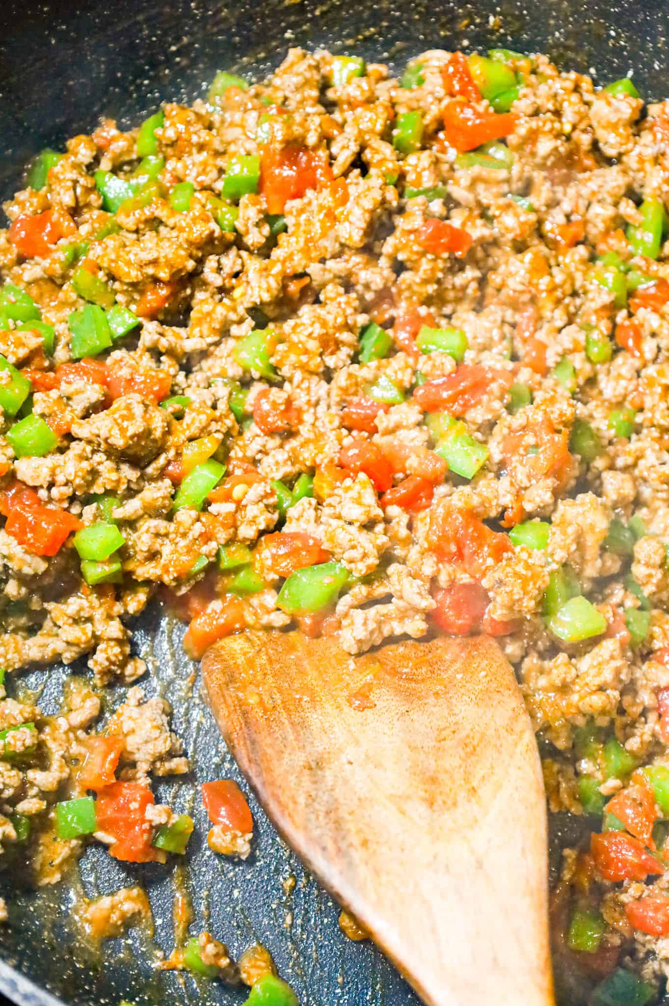 ground beef, Rotel, diced green peppers and taco seasoning mixture in a skillet