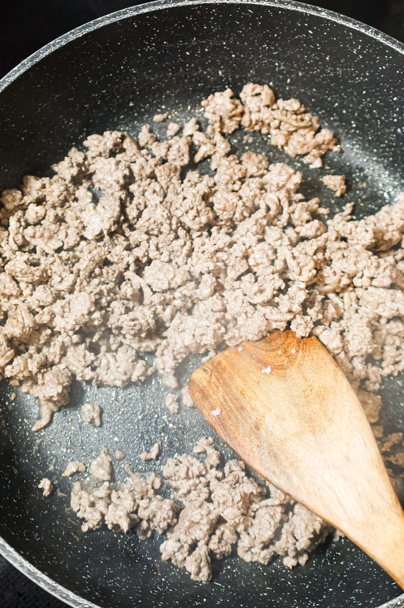 ground beef being browned in a skillet