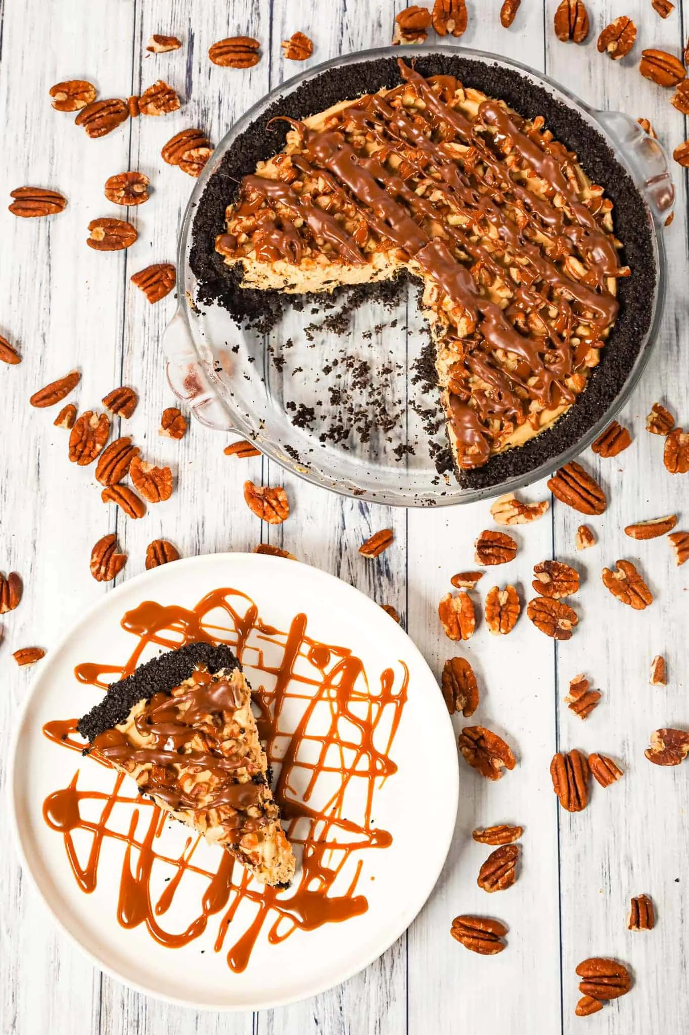 Turtle Pie is a delicious no bake cheesecake pie in an Oreo crust and loaded with caramel sauce, milk chocolate and chopped pecans.