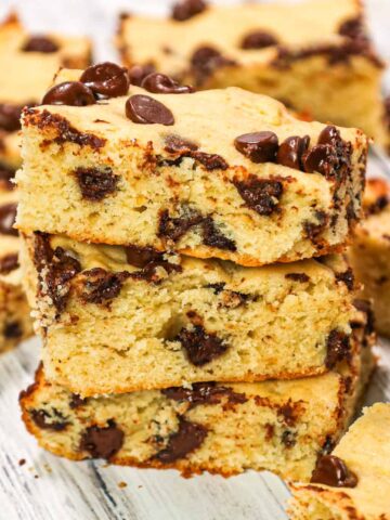 Banana Chocolate Chip Bars are an easy dessert recipe made with ripe bananas and loaded with semi sweet chocolate chips.