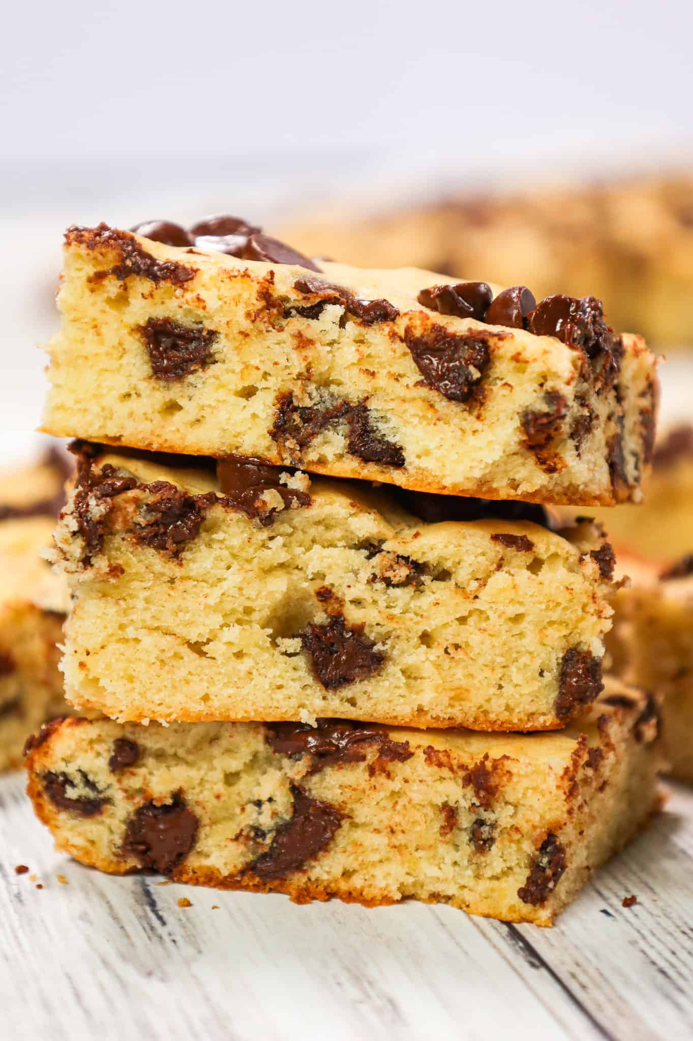 Banana Chocolate Chip Bars are an easy dessert recipe made with ripe bananas and loaded with semi sweet chocolate chips.