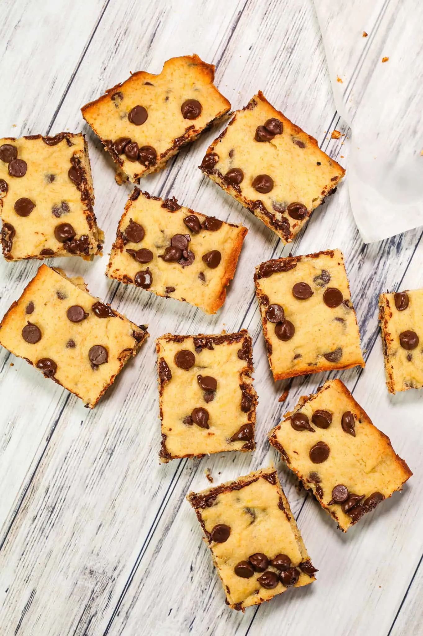 Banana Chocolate Chip Bars are an easy dessert recipe made with ripe bananas and loaded with semi sweet chocolate chips.