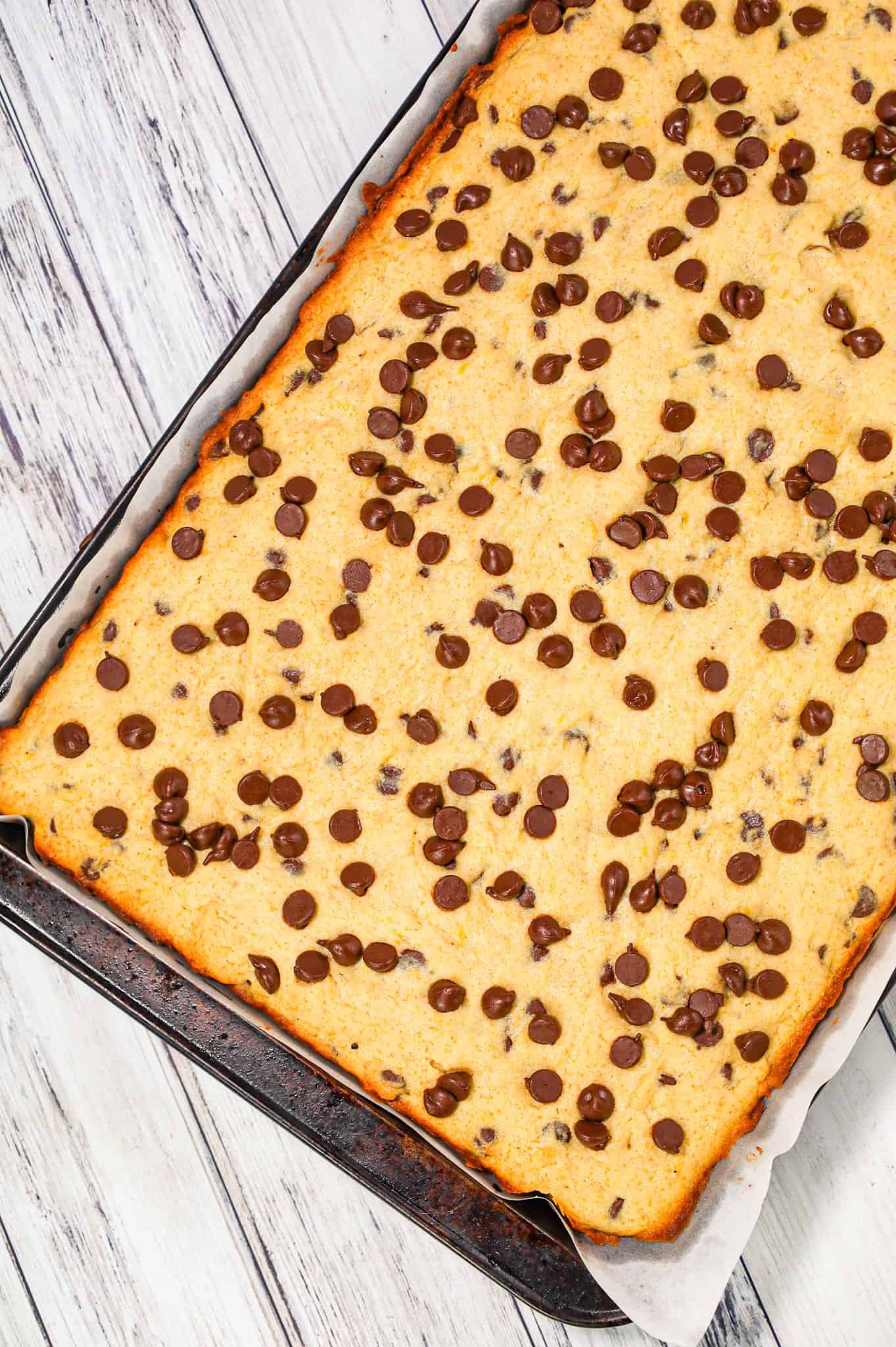 Banana Chocolate Chip Bars are an easy dessert recipe made with ripe bananas and loaded with semi sweet chocolate chips.