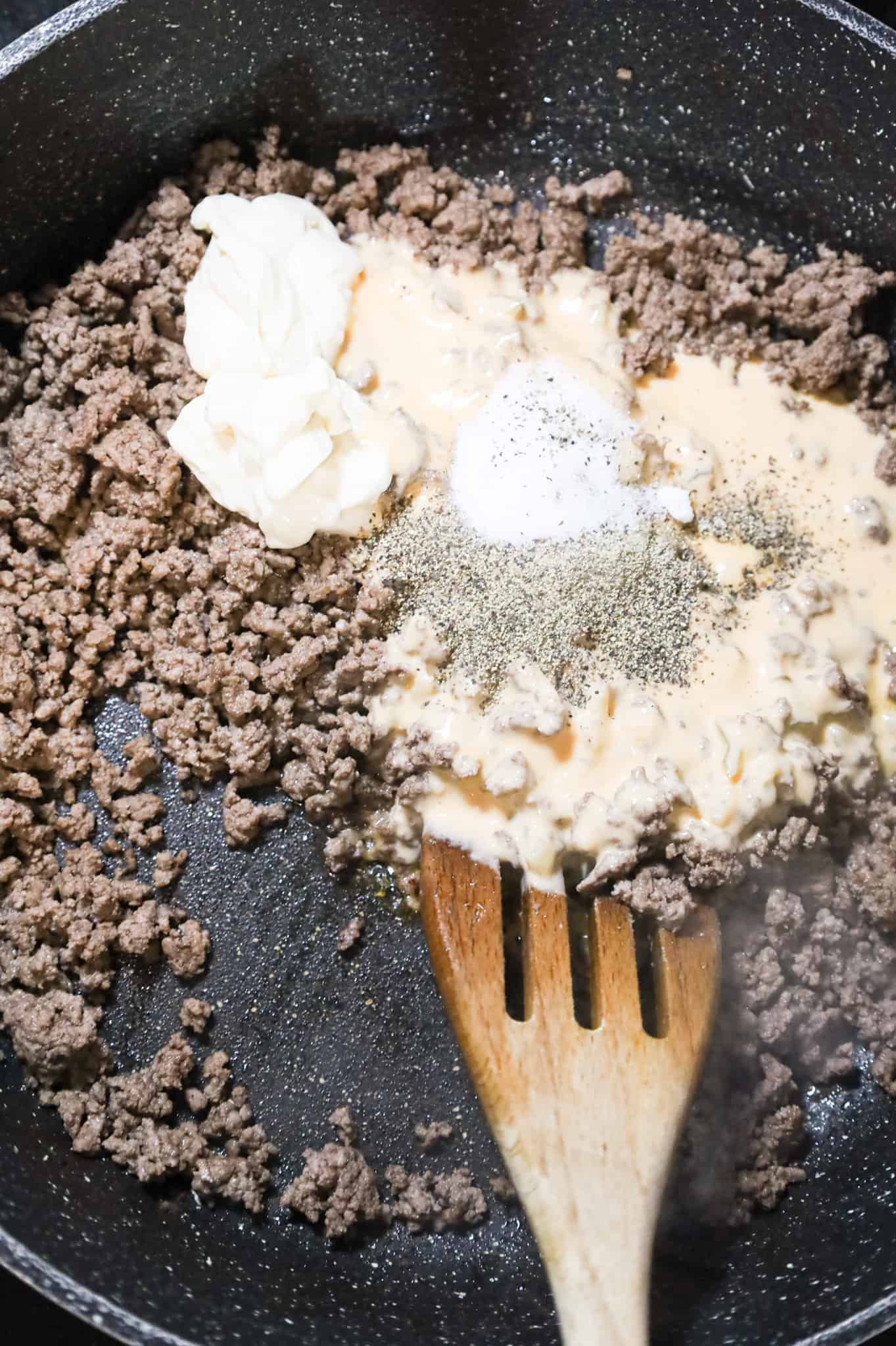 mayo, Thousand Island dressing, salt and pepper on top of ground beef in a skillet