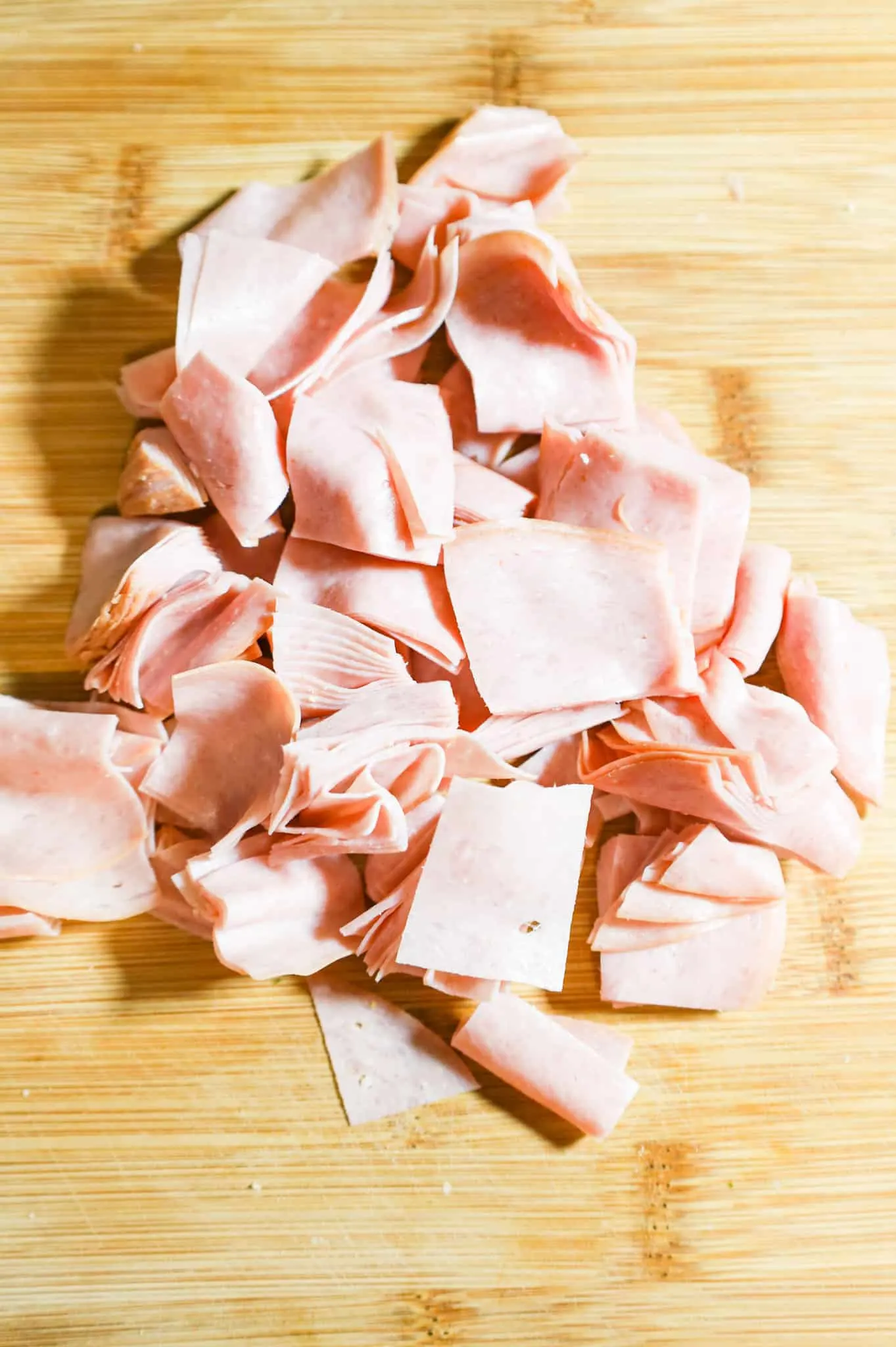 chopped ham on a cutting board