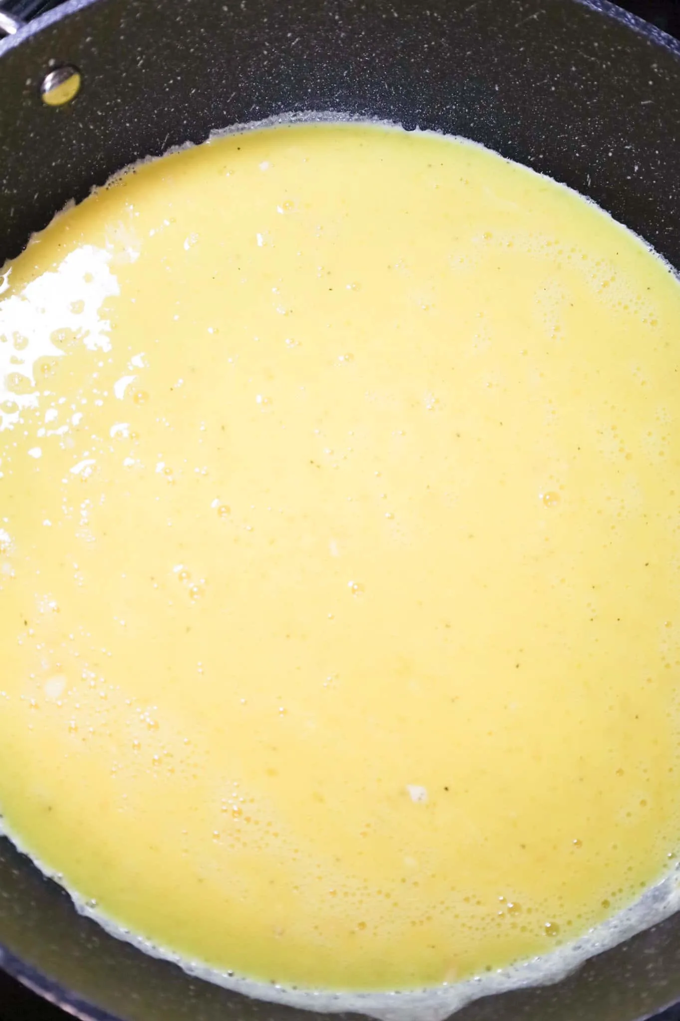 beaten egg mixture in a skillet