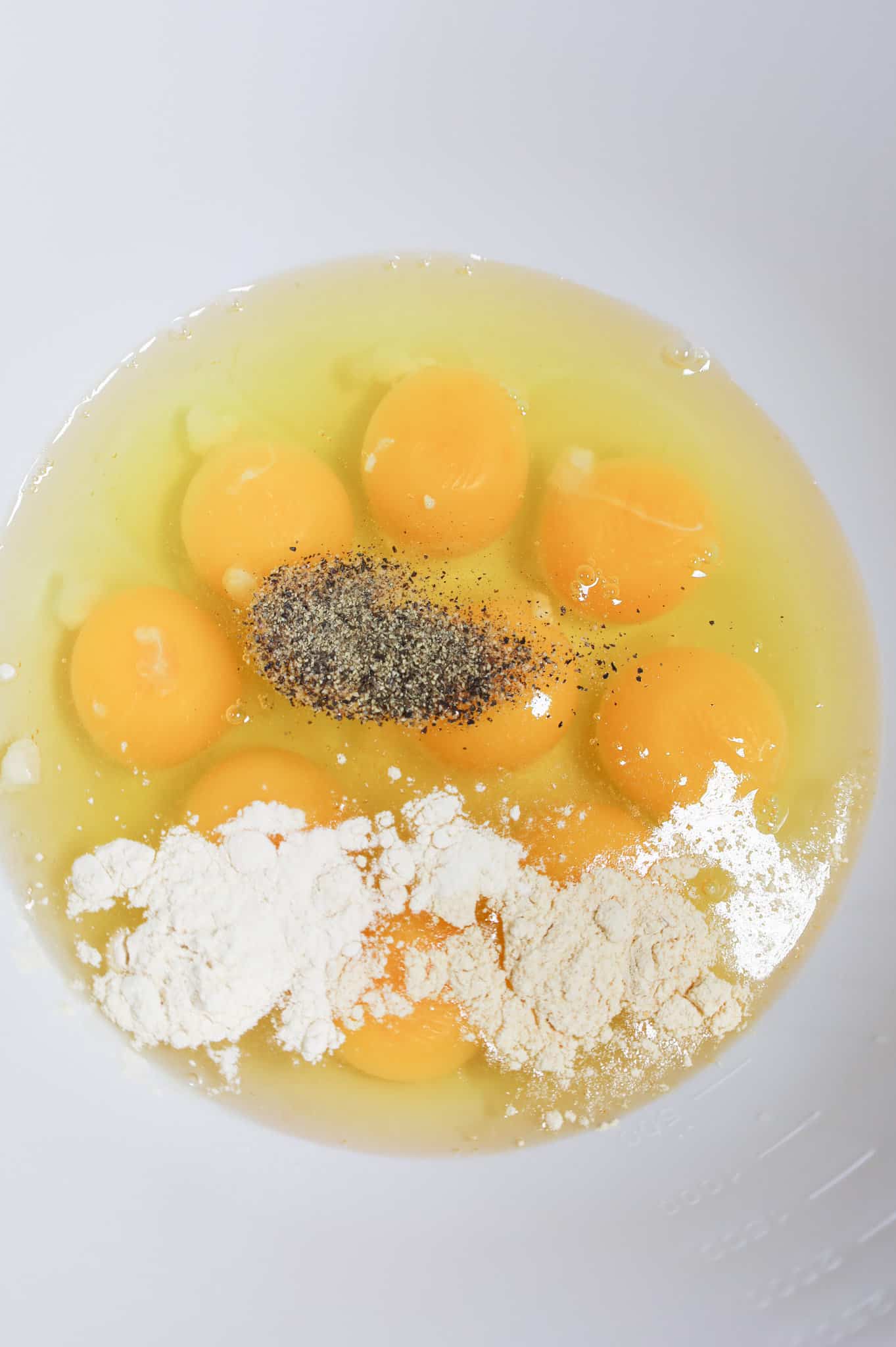 spices and eggs in a mixing bowl