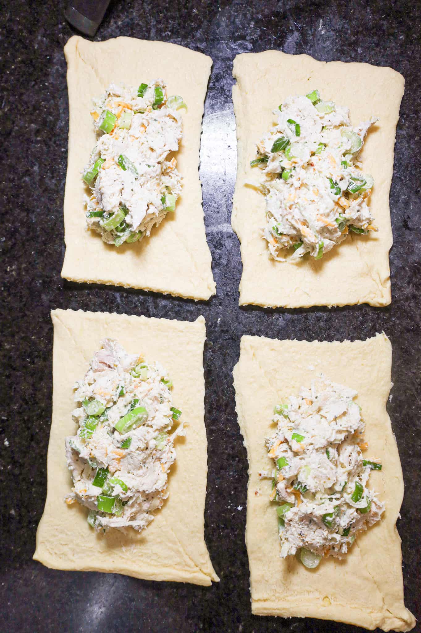 chicken mixture scooped onto rectangles of crescent dough