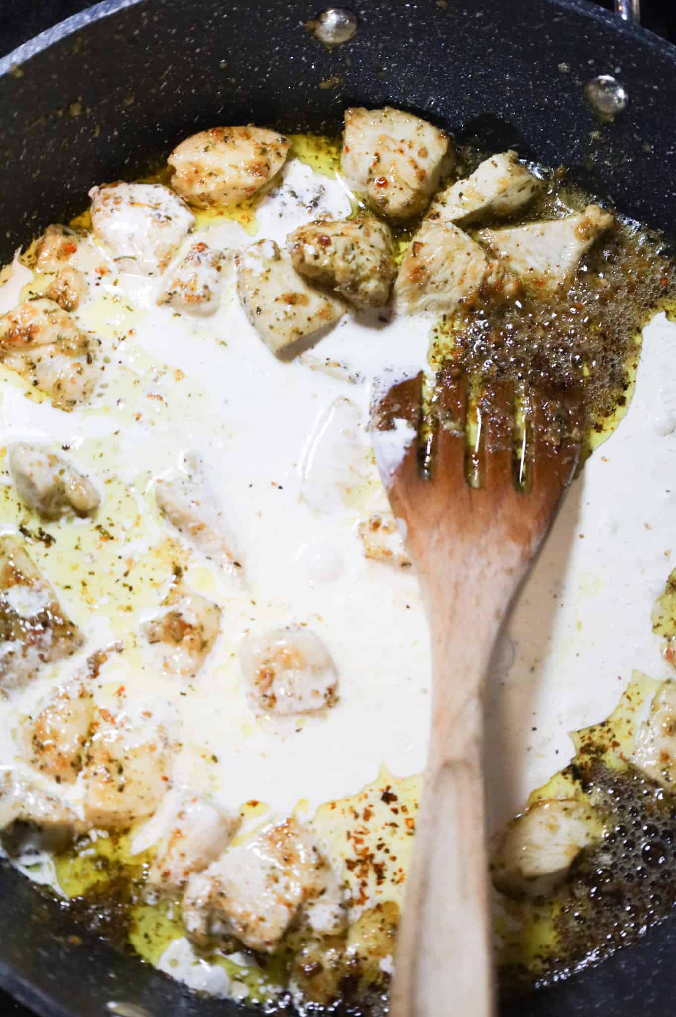 salt, pepper and heavy cream added to skillet with cooked chicken breast chunks