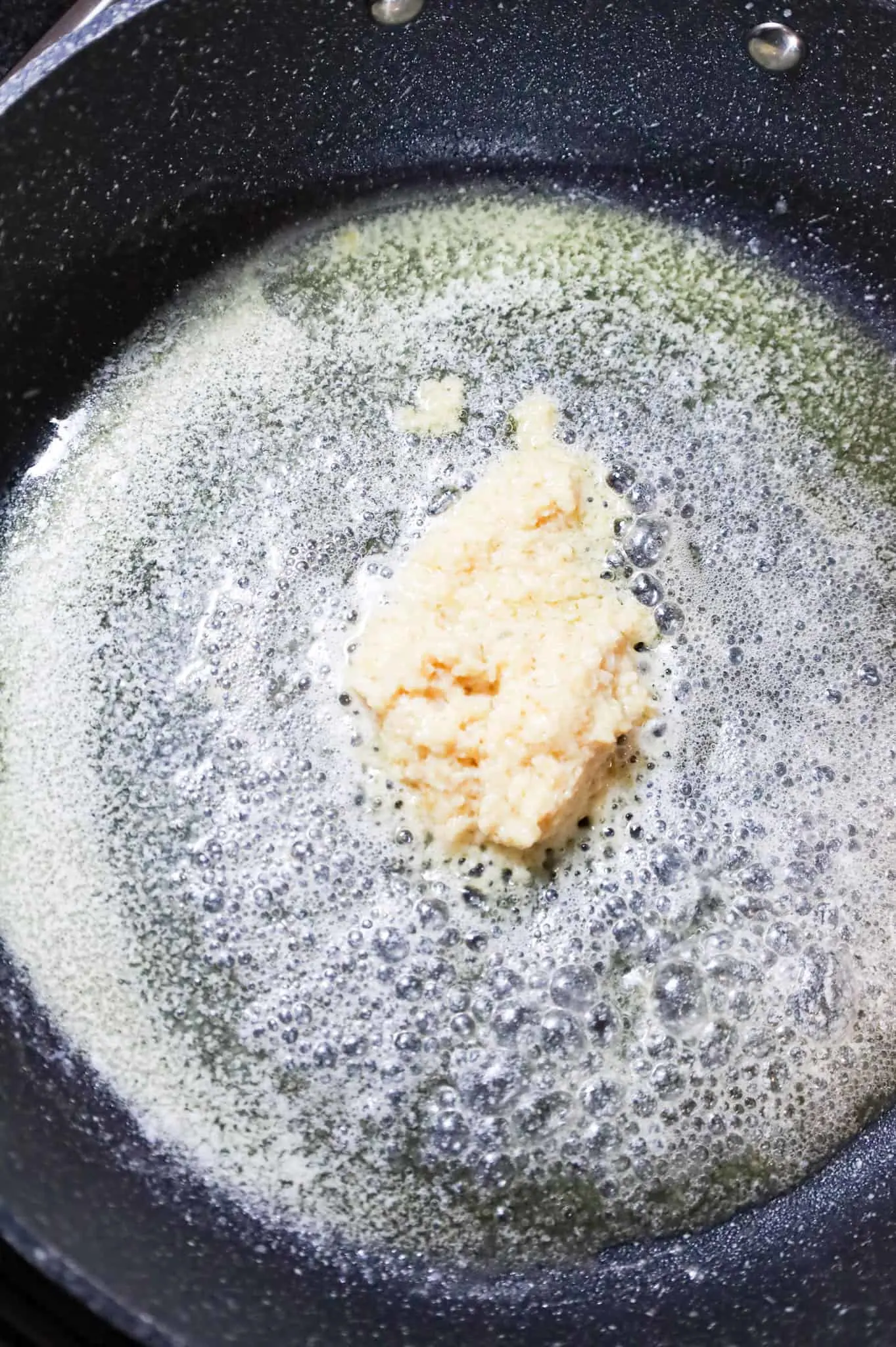 melted butter and garlic puree in a skillet