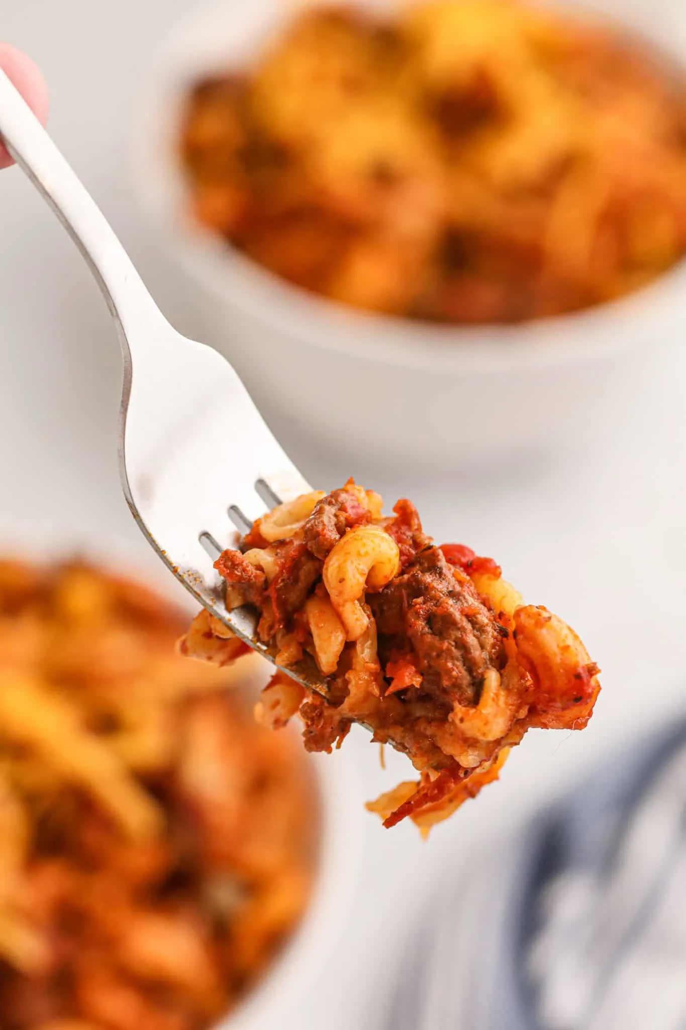 Crock Pot Goulash is an easy slow cooker ground beef and macaroni recipe with a tomato sauce and topped with cheddar cheese.