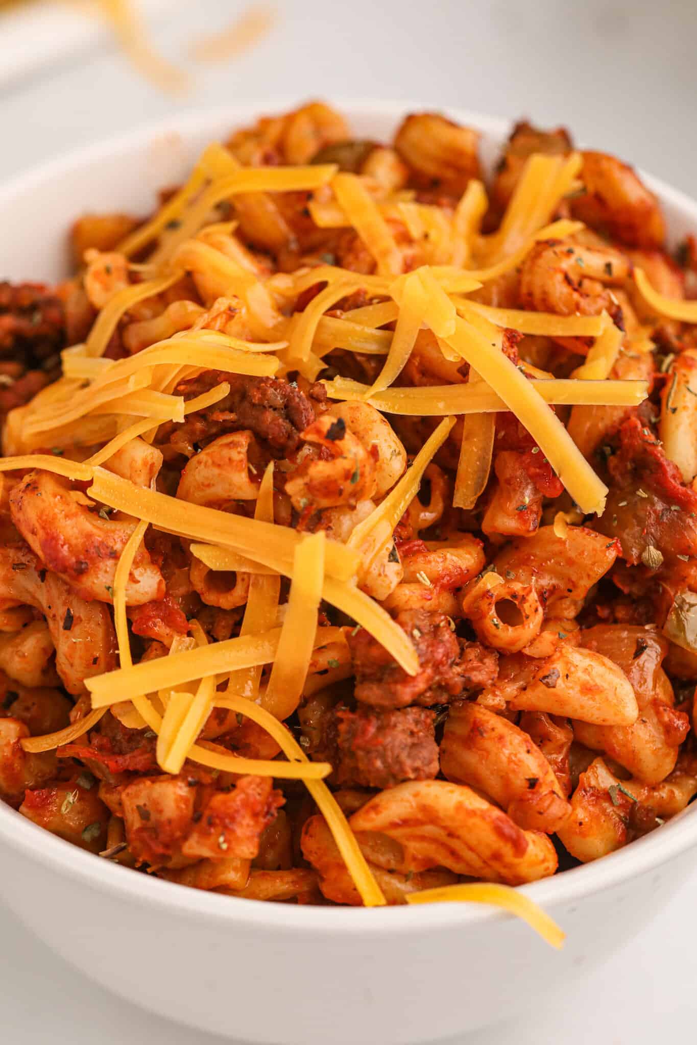 Crock Pot Goulash is an easy slow cooker ground beef and macaroni recipe with a tomato sauce and topped with cheddar cheese.