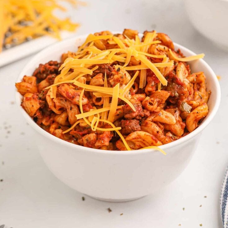 Crock Pot Goulash is an easy slow cooker ground beef and macaroni recipe with a tomato sauce and topped with cheddar cheese.