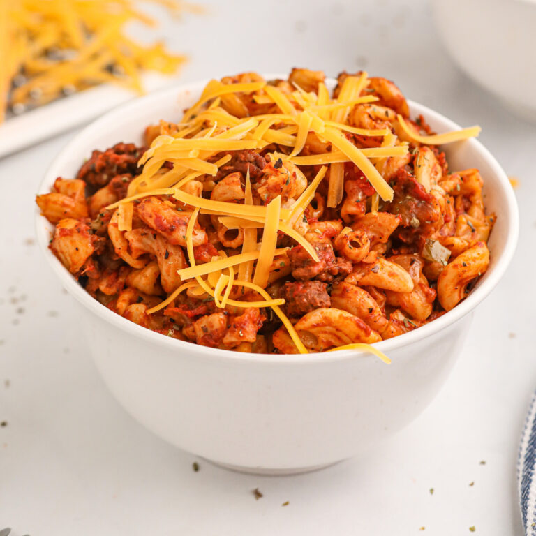 Crock Pot Goulash is an easy slow cooker ground beef and macaroni recipe with a tomato sauce and topped with cheddar cheese.