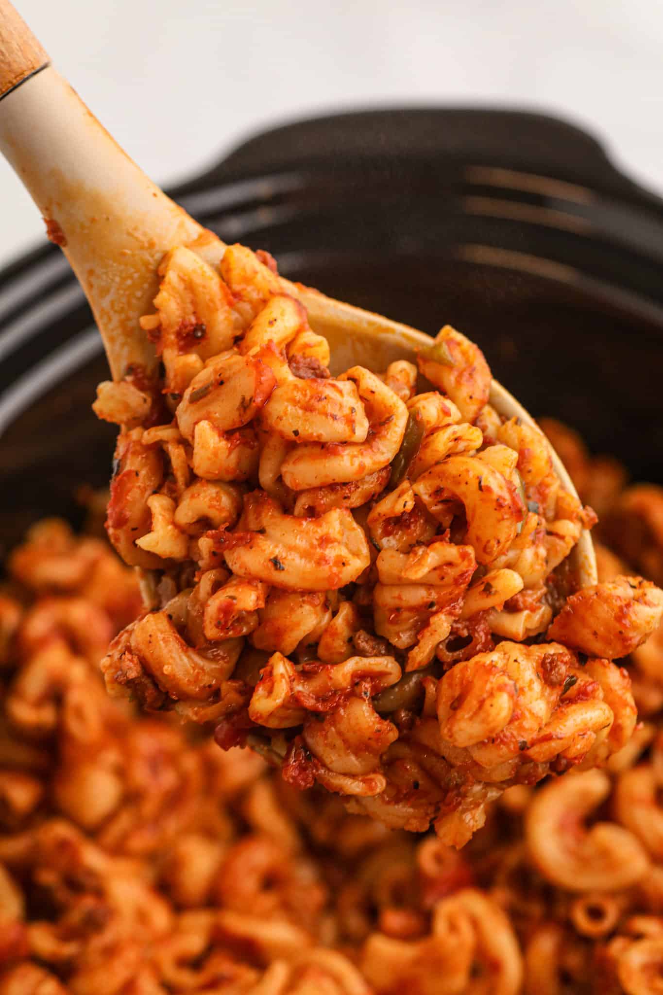 Crock Pot Goulash is an easy slow cooker ground beef and macaroni recipe with a tomato sauce and topped with cheddar cheese.