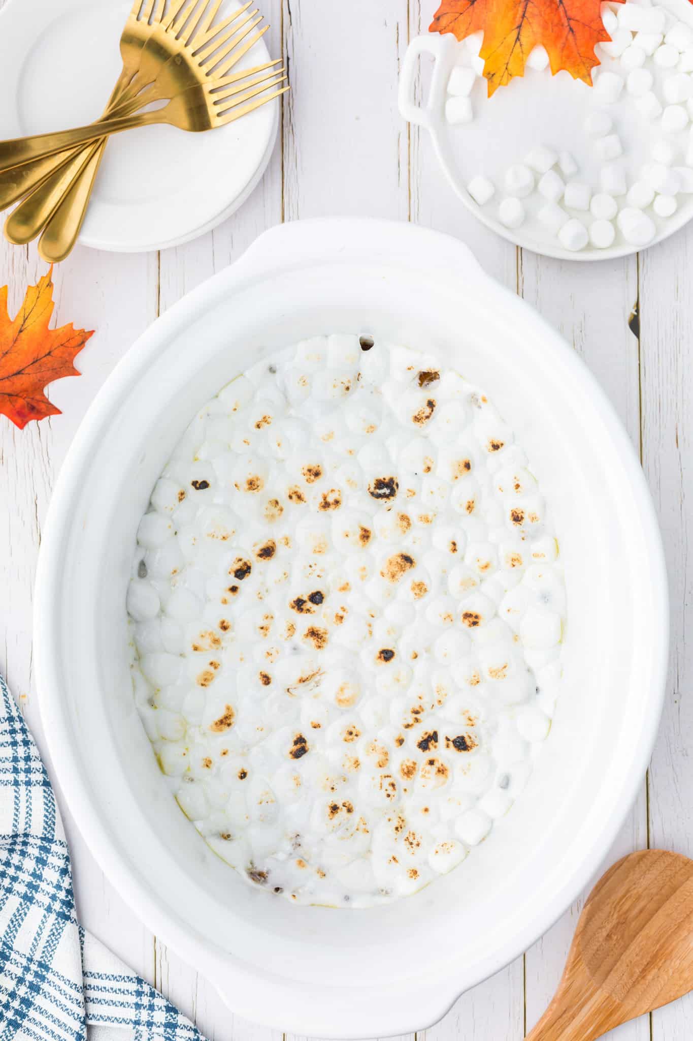 toast marshmallows on top of sweet potato casserole in a crock pot