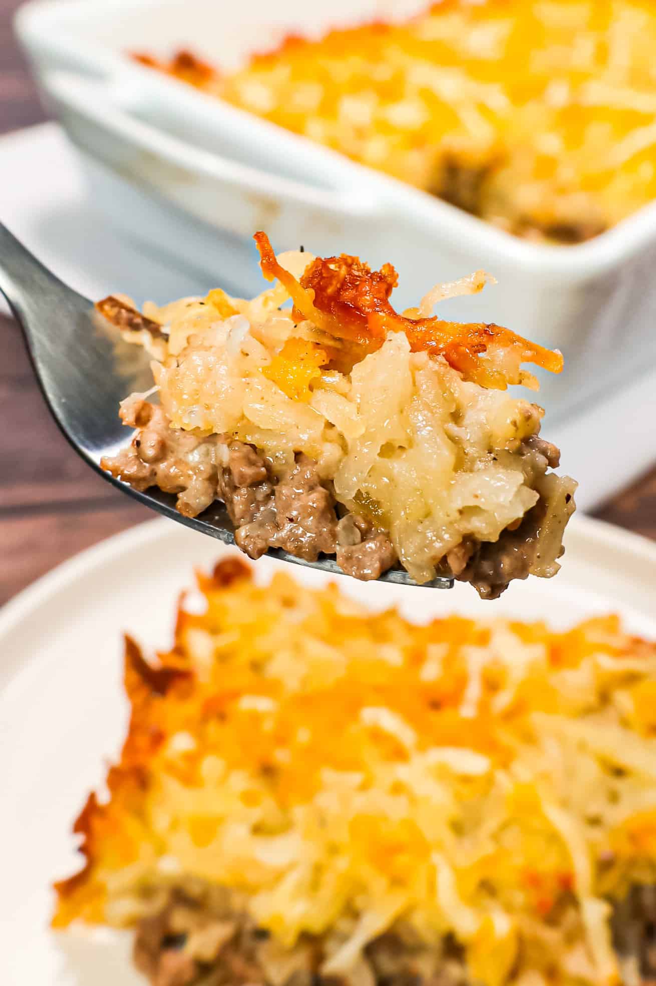 Hamburger Hashbrown Casserole is an easy ground beef dinner recipe loaded with shredded hashbrown potatoes, cream of mushroom soup and shredded mozzarella and cheddar cheese.