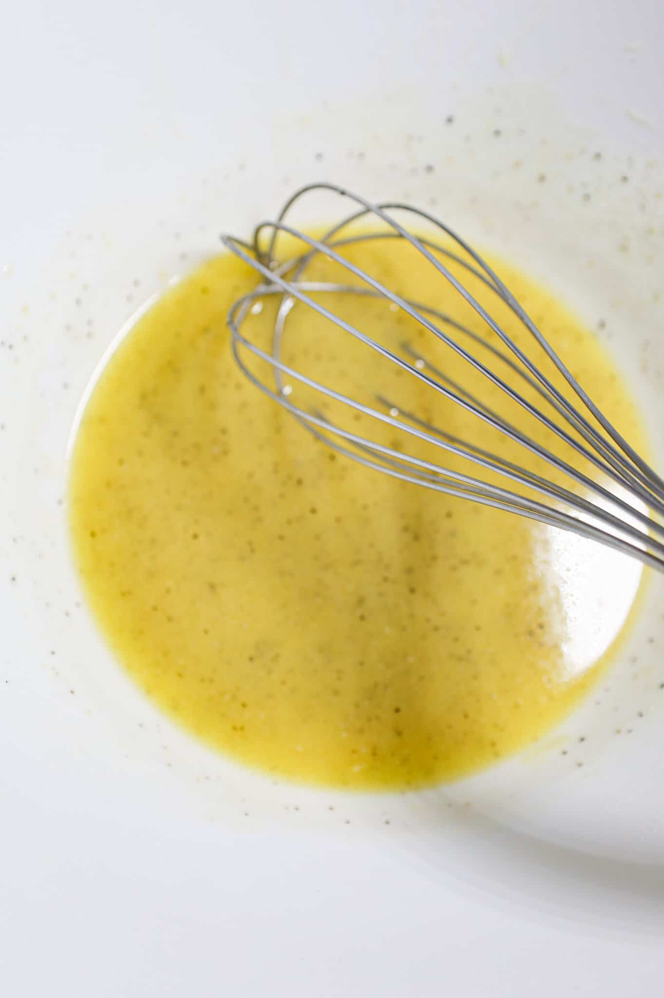 melted butter and spices whisked together in a mixing bowl