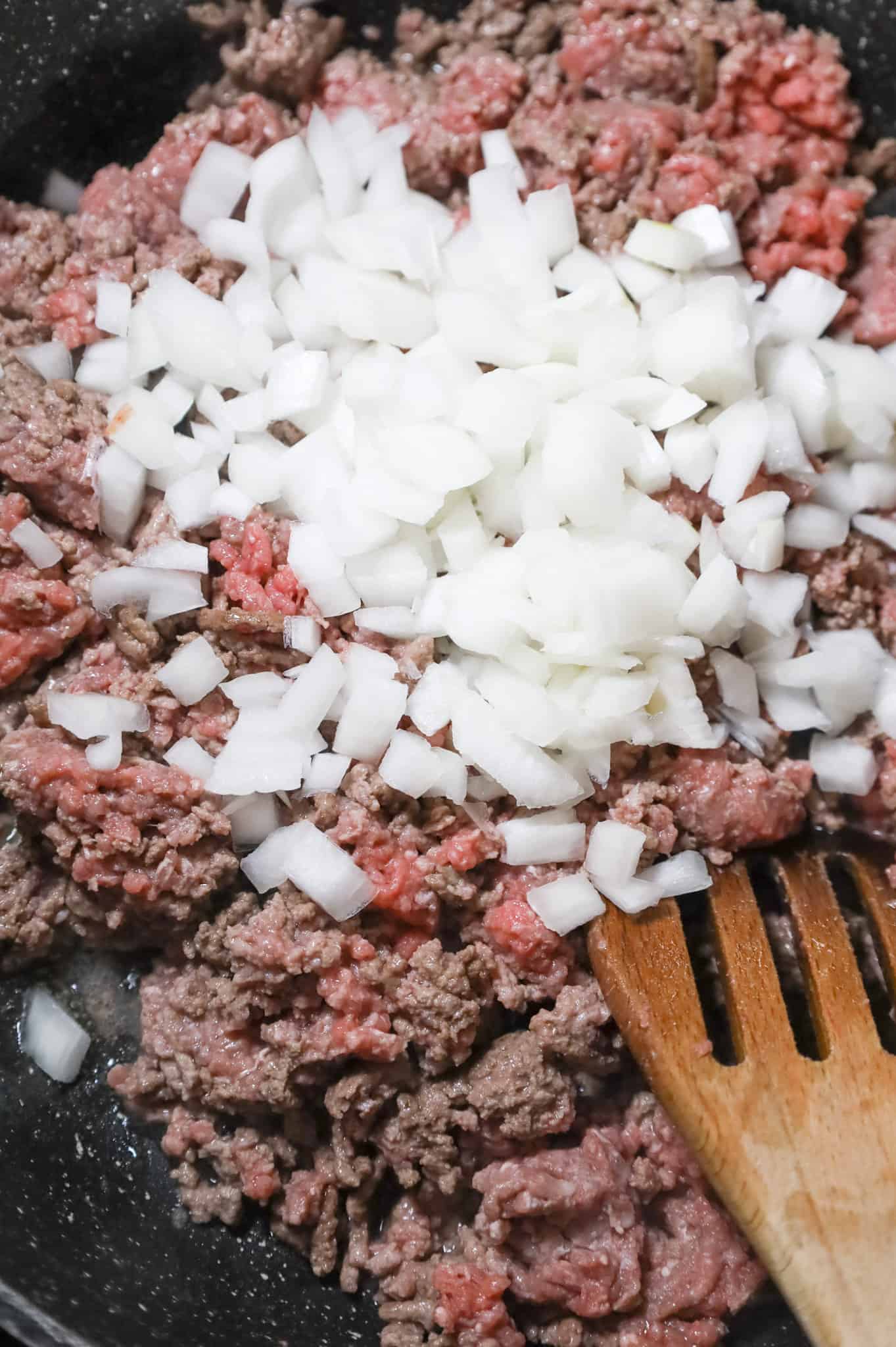 diced onions and ground beef in a skillet