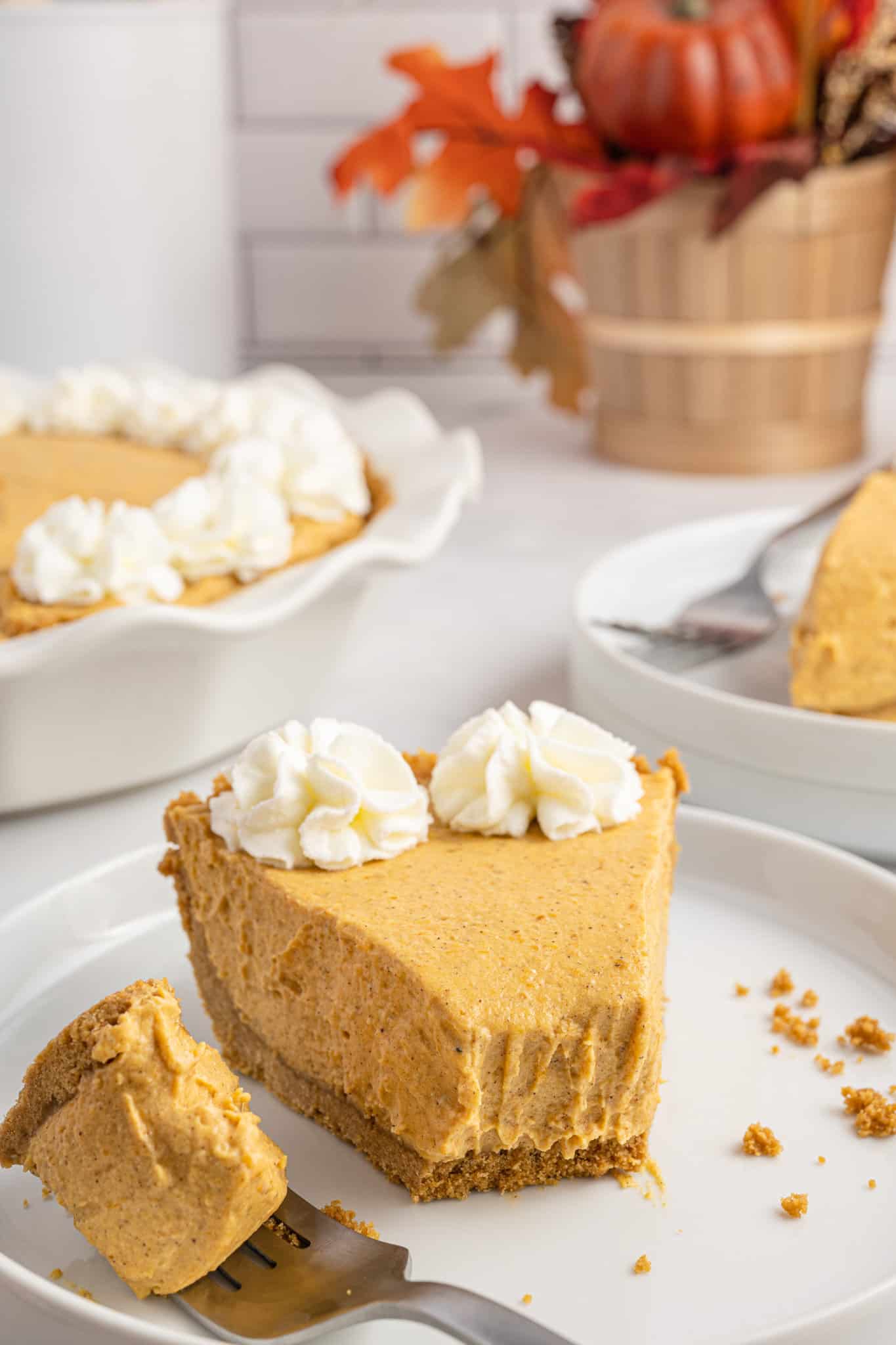 No Bake Pumpkin Pie is an easy fall dessert recipe with a ginger snap cookie crust and a creamy filling made with instant vanilla pudding mix, whipping cream and pumpkin puree.