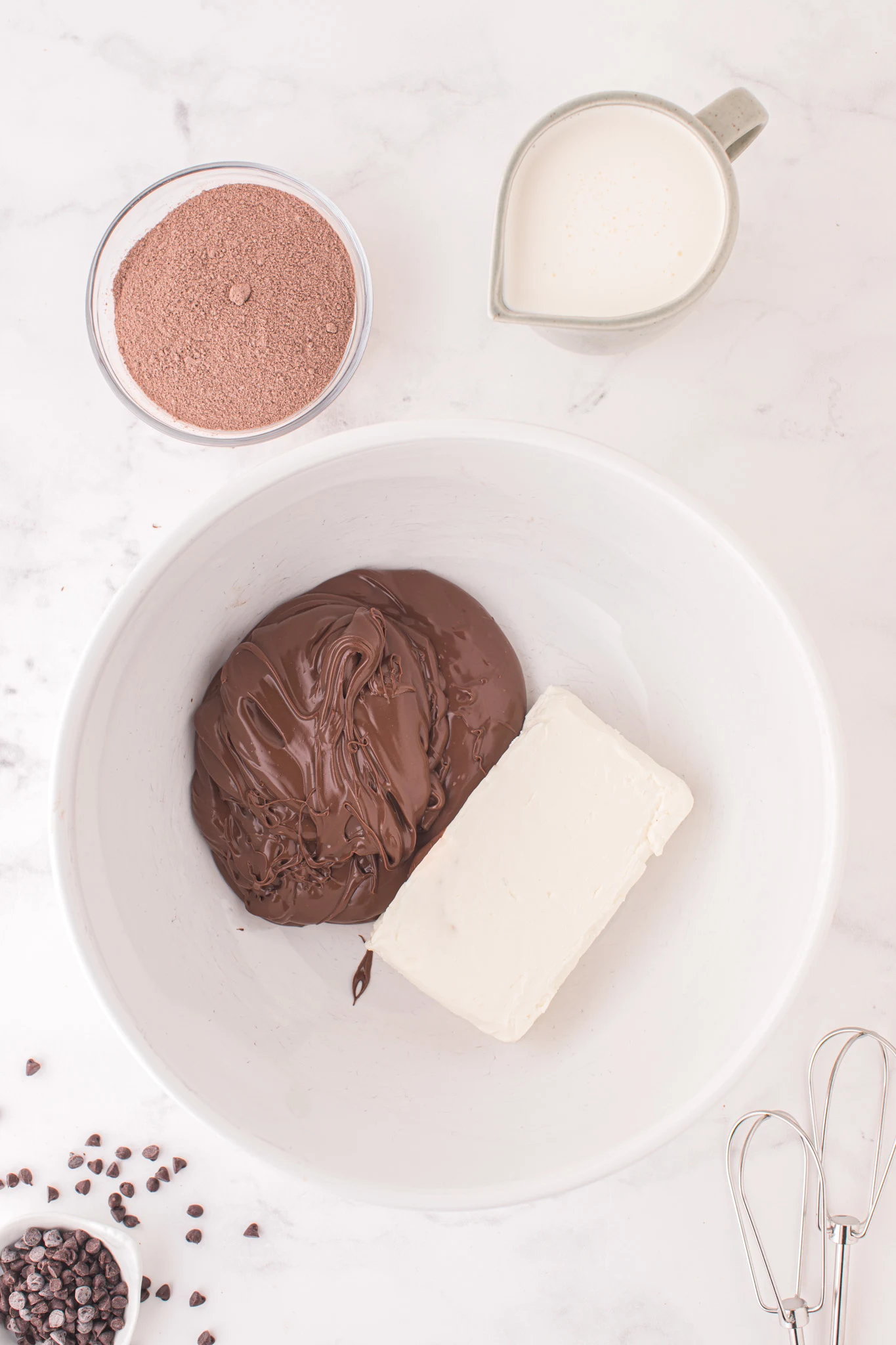 Nutella and softened cream cheese in a large mixing bowl