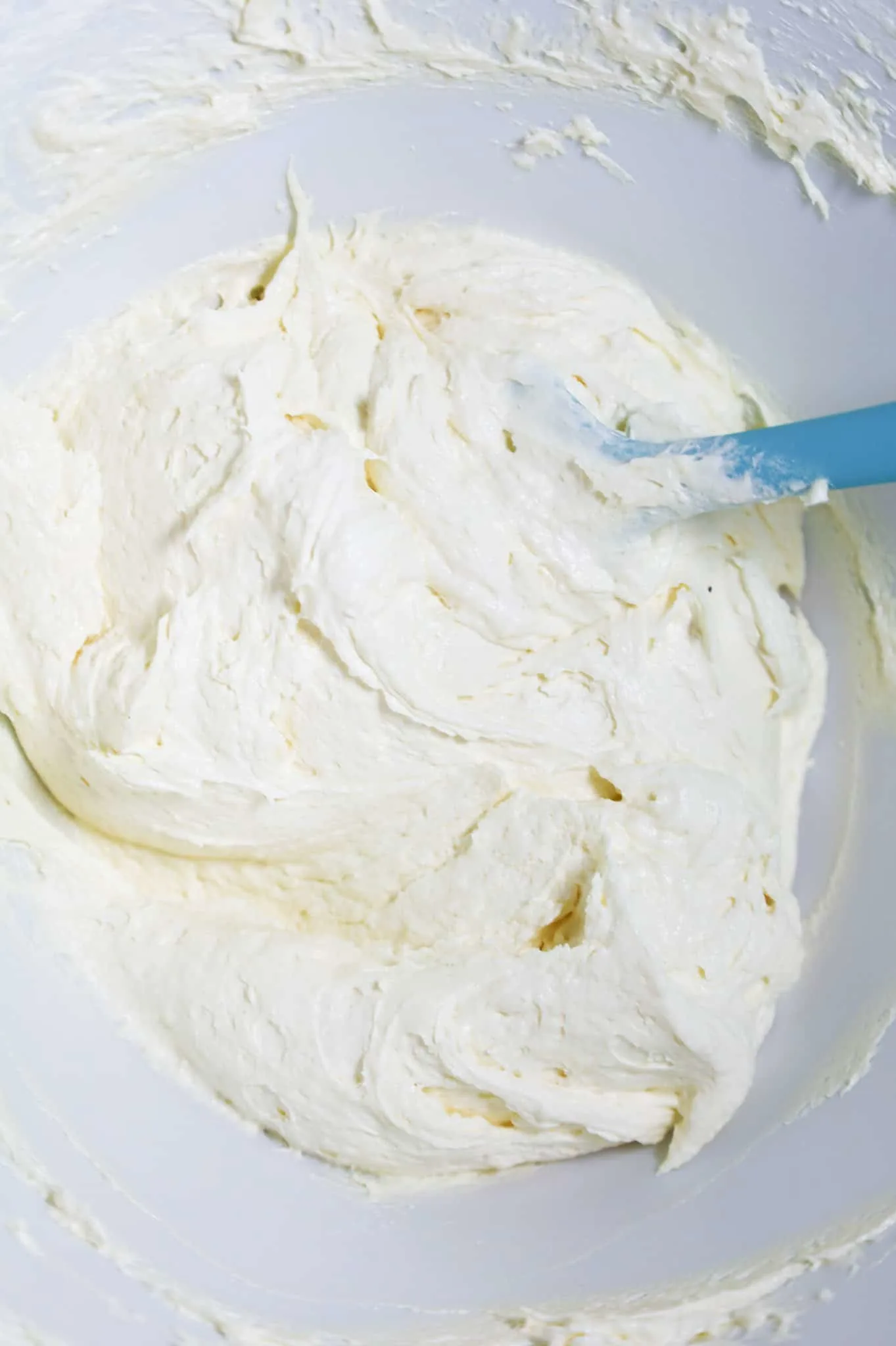 Cool Whip, cream cheese and pudding mix mixture in a mixing bowl
