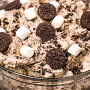 Oreo Fluff is an easy no bake dessert recipe made with cream cheese, instant vanilla pudding and Cool Whip and loaded with mini marshmallows and crumbled Oreo Cookies!