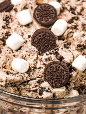 Oreo Fluff is an easy no bake dessert recipe made with cream cheese, instant vanilla pudding and Cool Whip and loaded with mini marshmallows and crumbled Oreo Cookies!