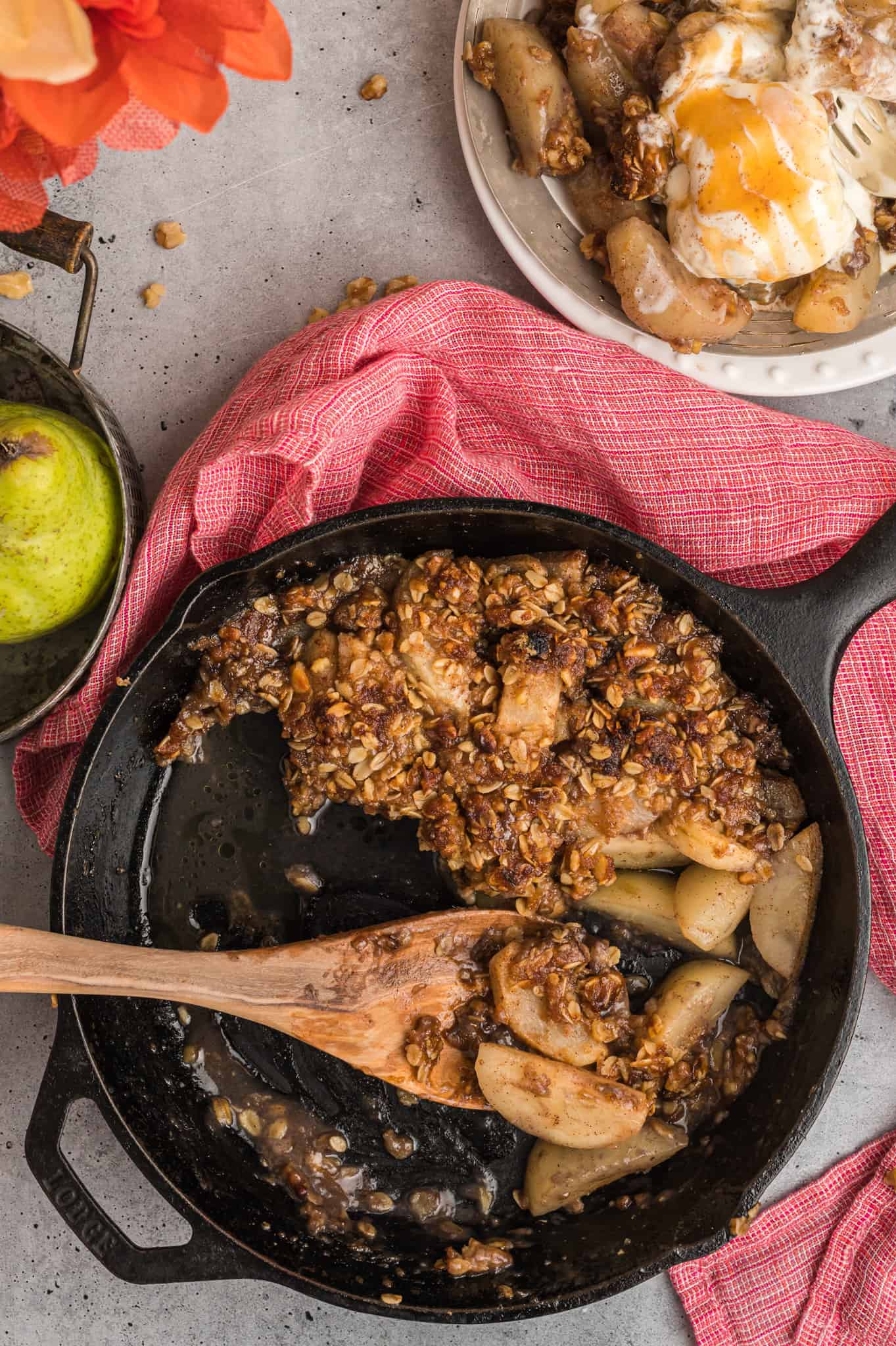 Pear Crisp is a delicious baked dessert with a sweet pear filling and a crunchy oat and walnut crumble topping.