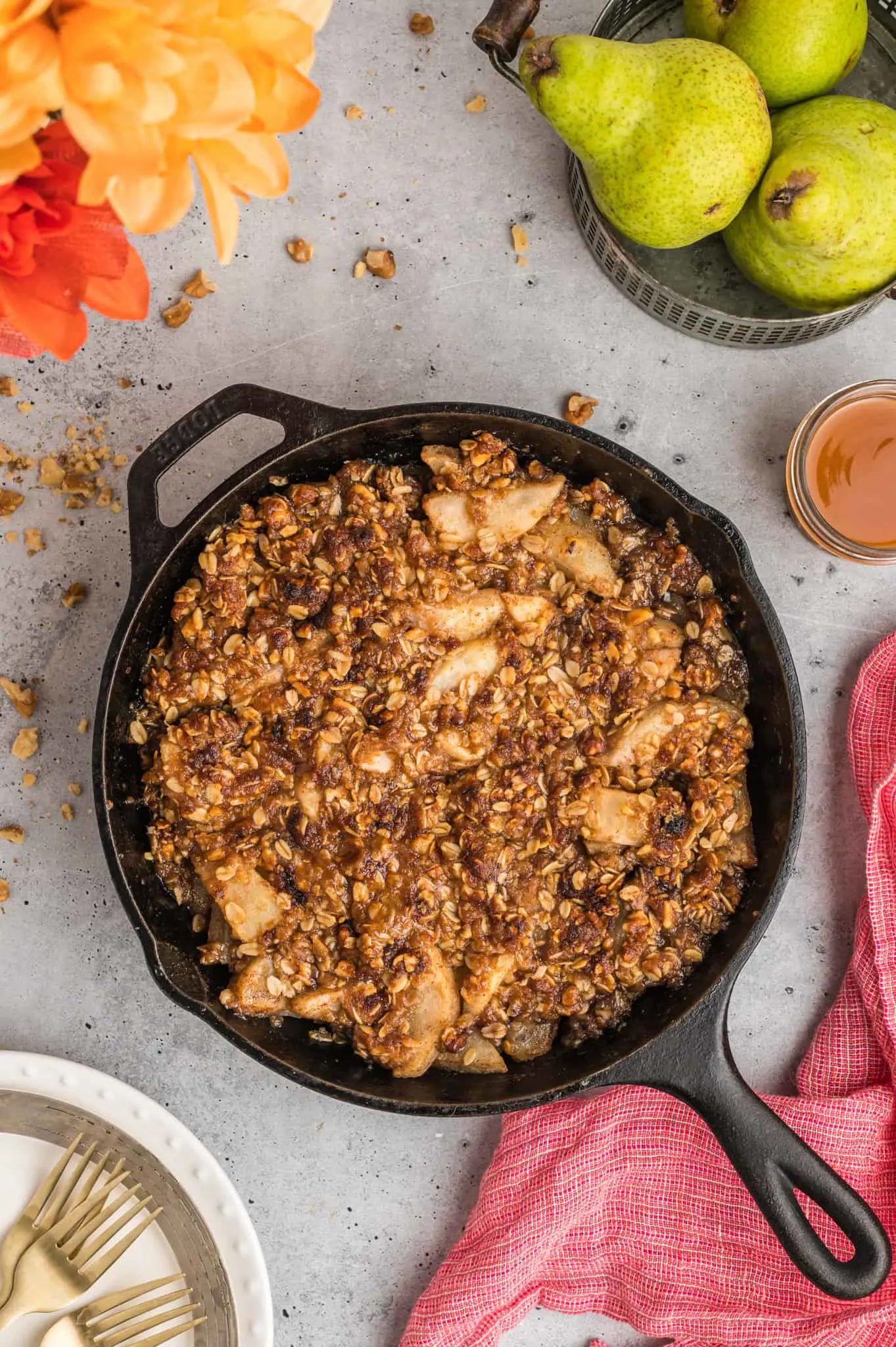 Pear Crisp is a delicious baked dessert with a sweet pear filling and a crunchy oat and walnut crumble topping.