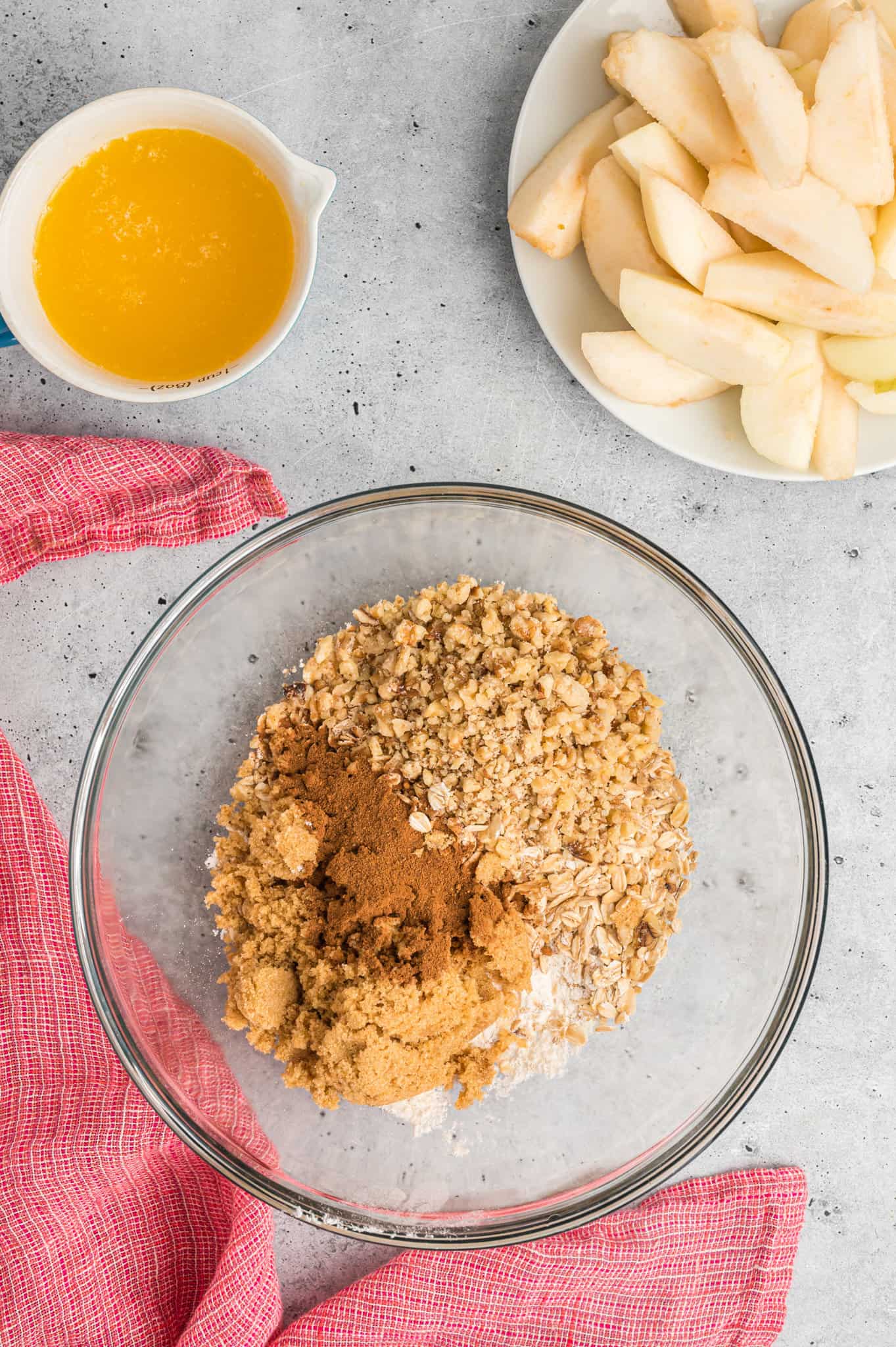 brown sugar, oats, flour and apple pie spice in a mixing bowl