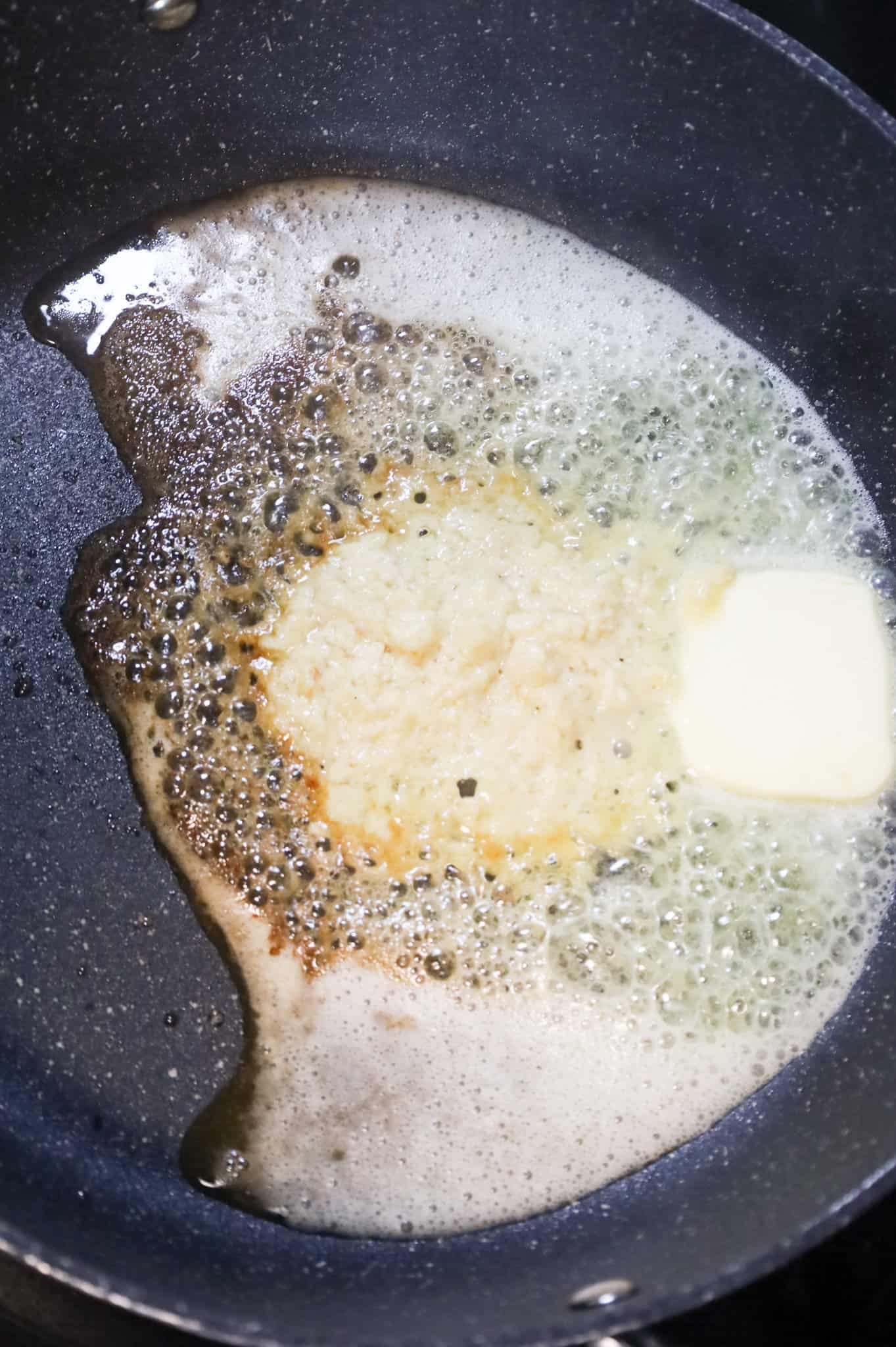 melted butter and garlic puree in a skillet