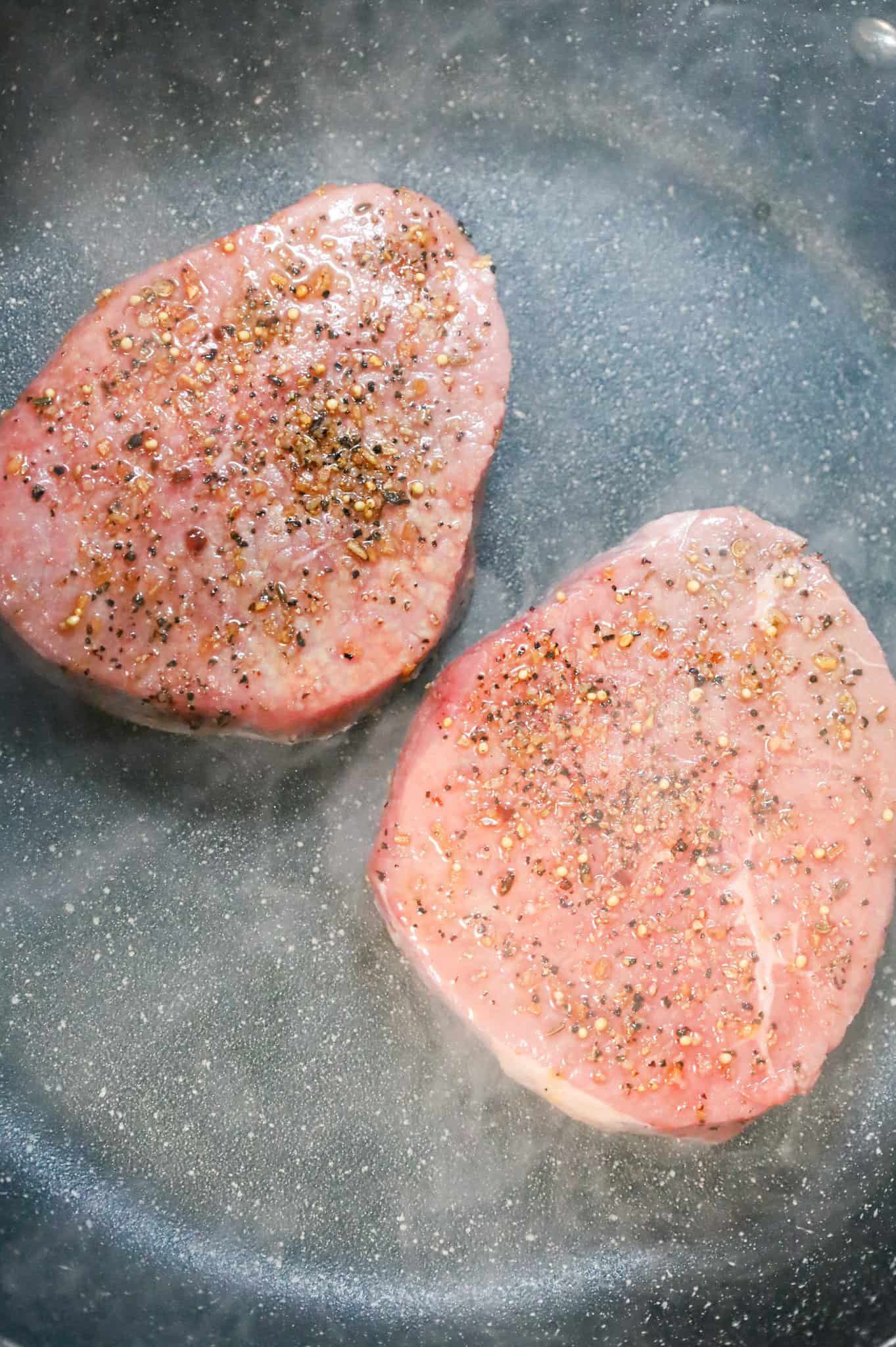 eye of round steaks in a hot skillet
