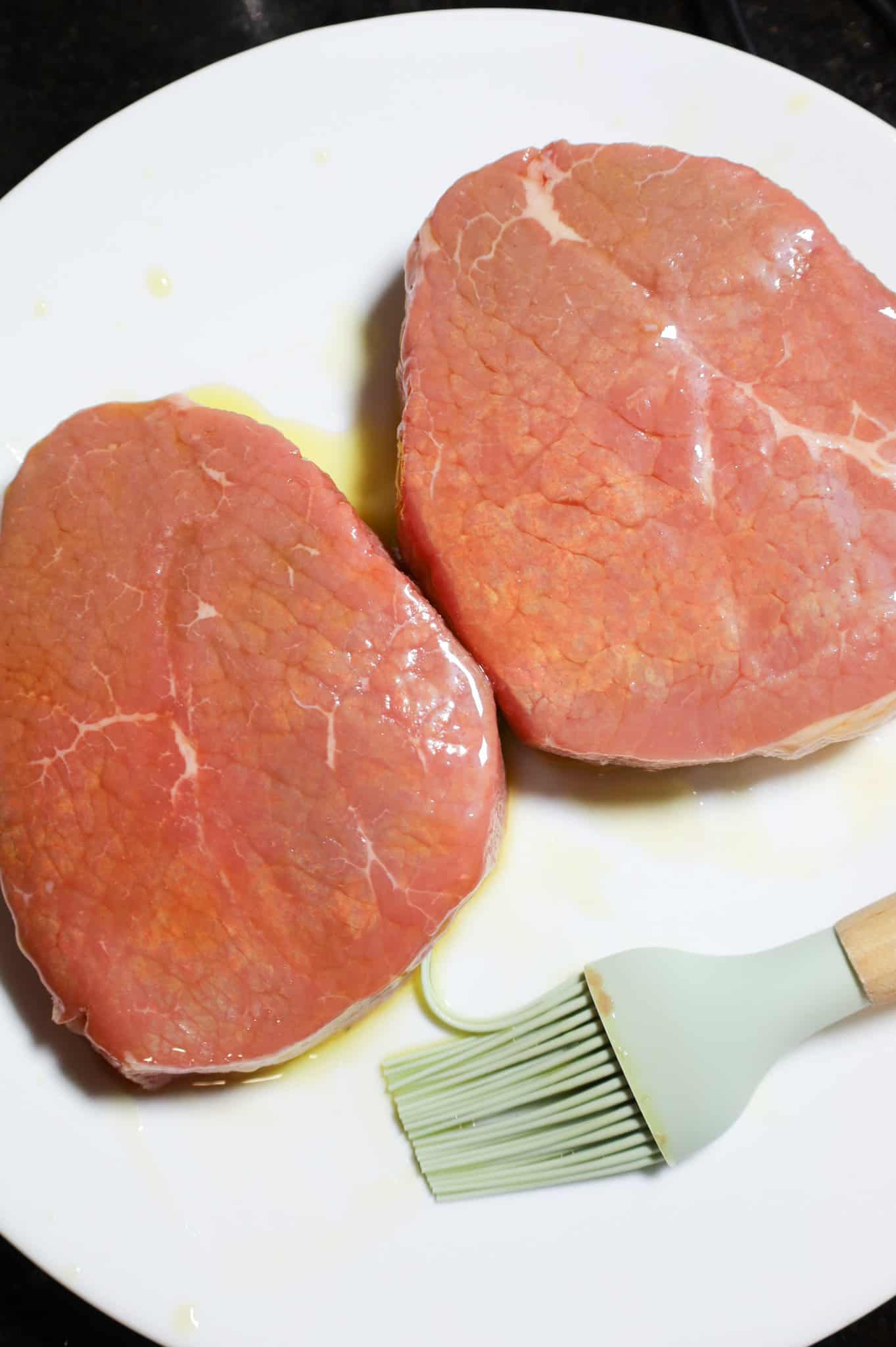 eye of round steaks brushed with oil