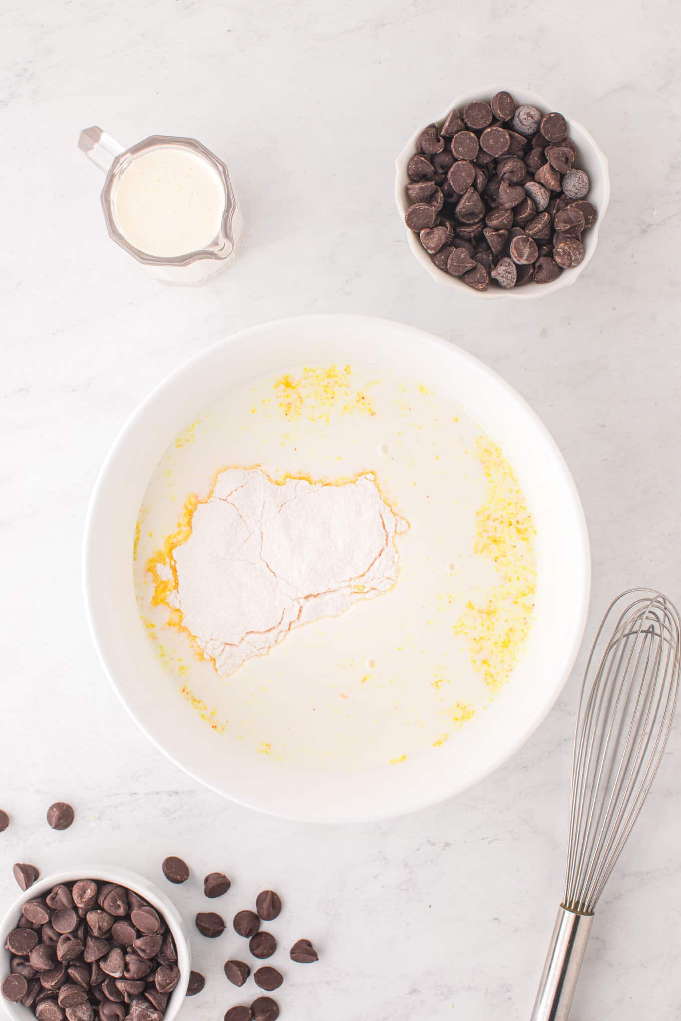 cream and vanilla pudding mix in a mixing bowl