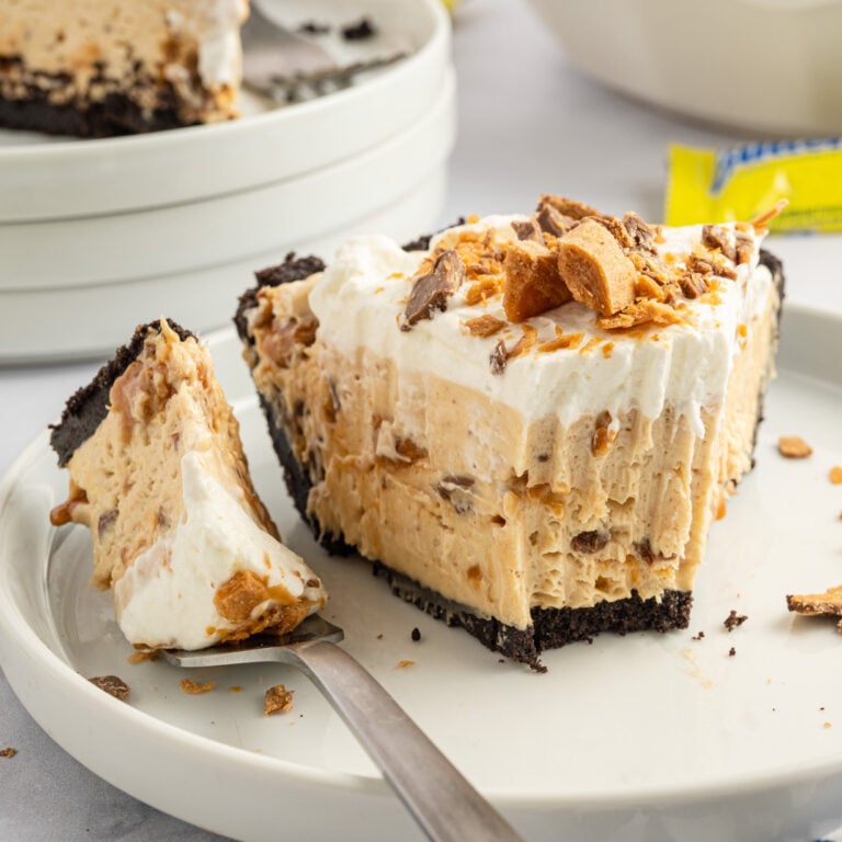 Butterfinger Pie is an easy no bake dessert recipe with an Oreo crust and a creamy peanut butter filling loaded with crumbled Butterfinger candy bars.