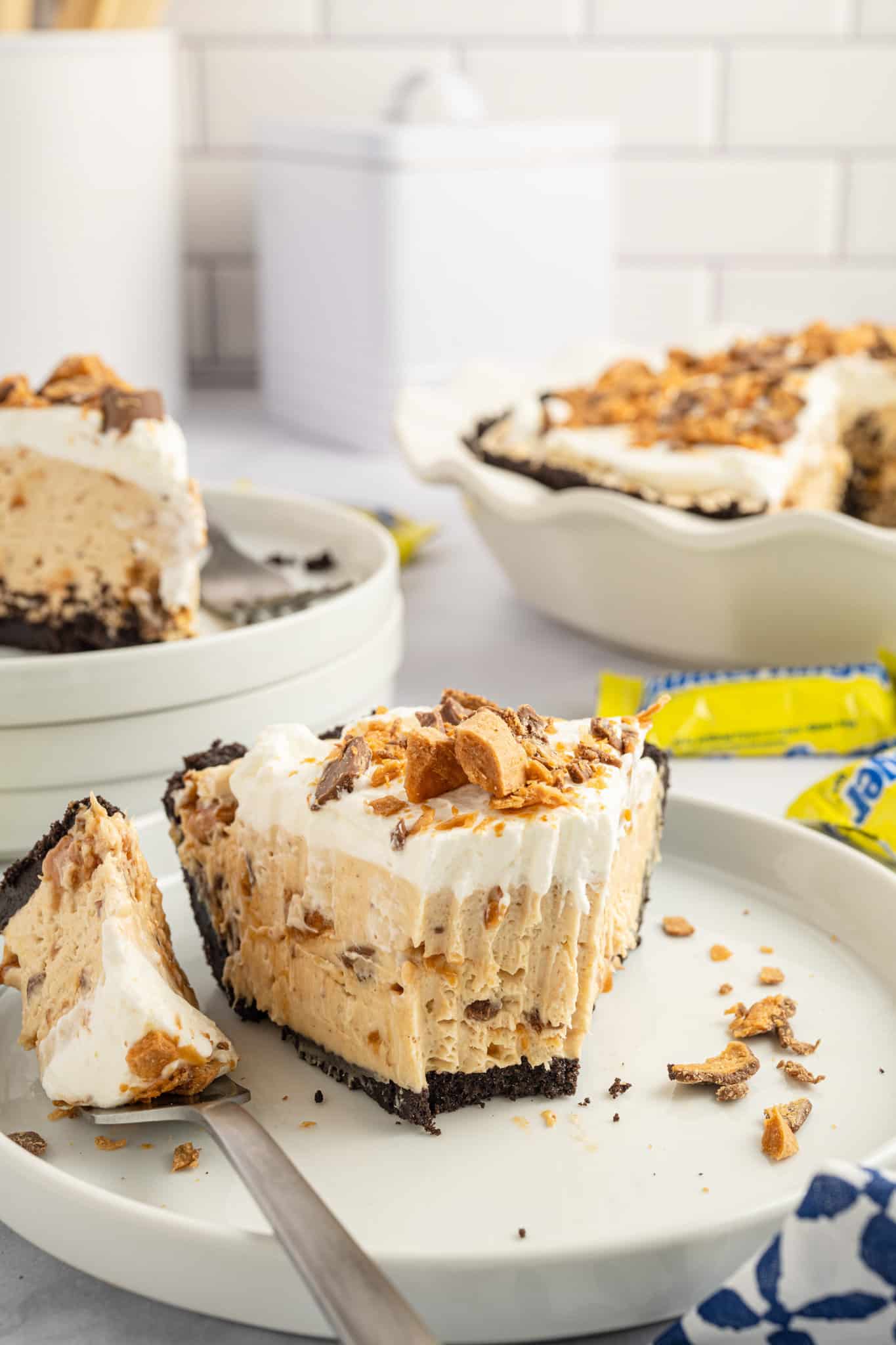 Butterfinger Pie is an easy no bake dessert recipe with an Oreo crust and a creamy peanut butter filling loaded with crumbled Butterfinger candy bars.