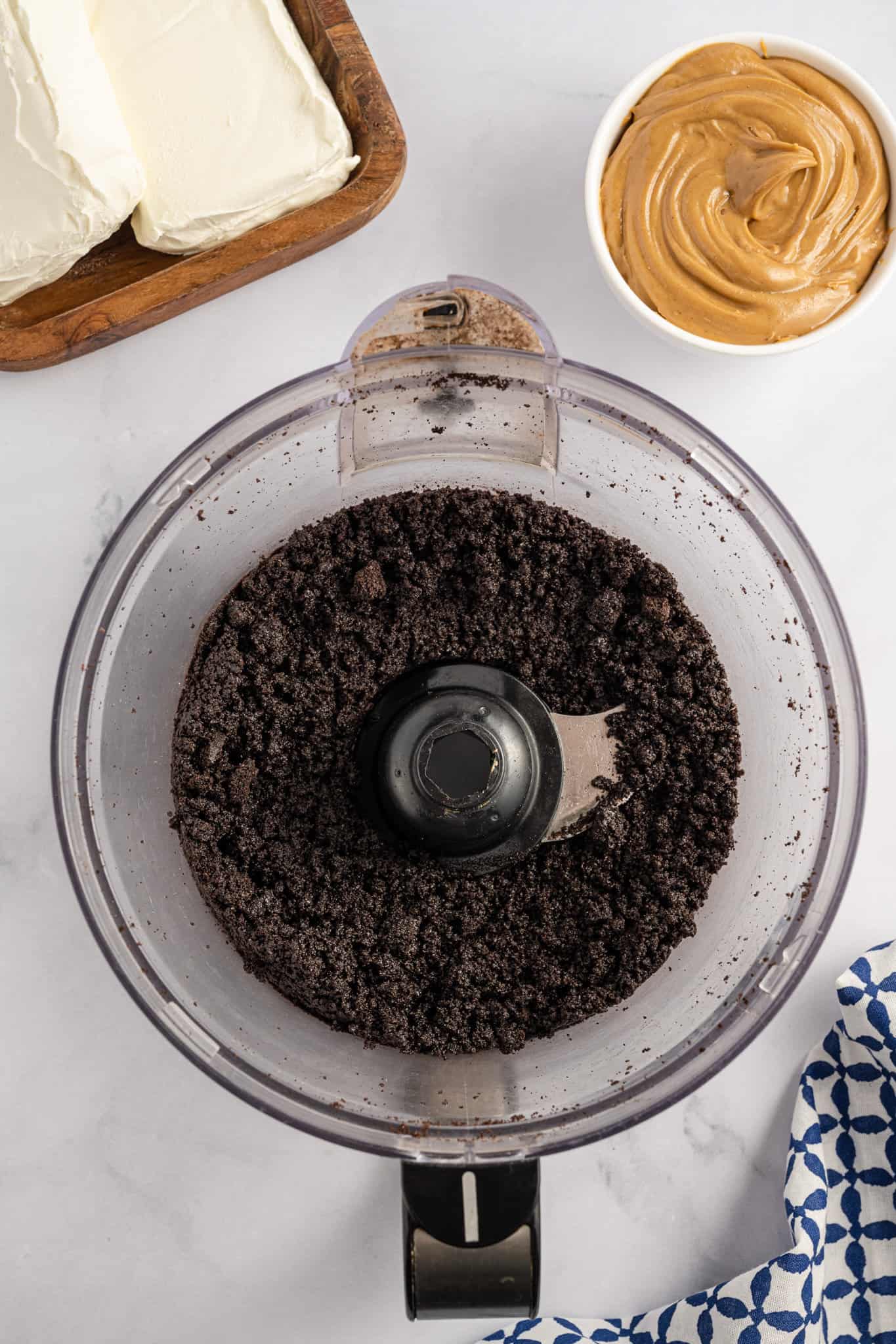Oreo cookie crumbs in a food processor