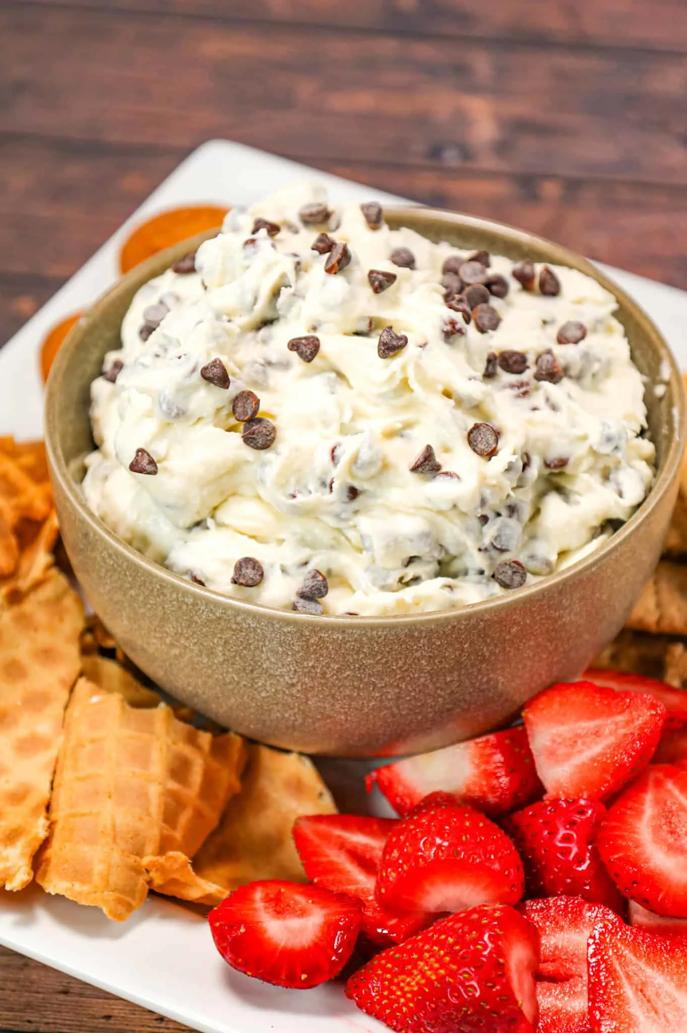 Cannoli Dip is an easy no bake dessert recipe made with ricotta cheese, cream cheese, confectioner's sugar and loaded with mini semi sweet chocolate chips.