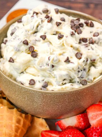 Cannoli Dip is an easy no bake dessert recipe made with ricotta cheese, cream cheese, confectioner's sugar and loaded with mini semi sweet chocolate chips.