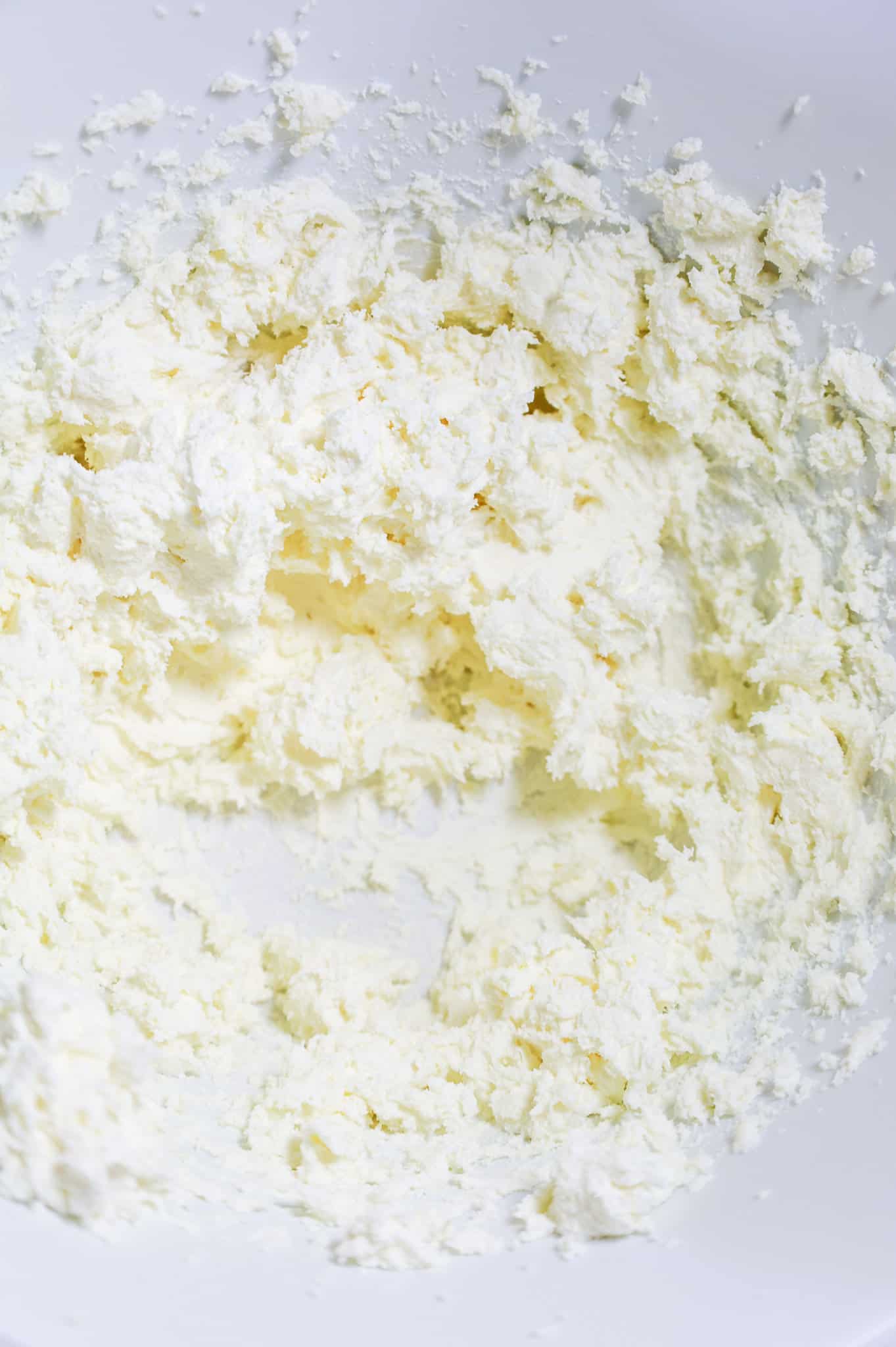 ricotta and cream cheese mixture in a mixing bowl